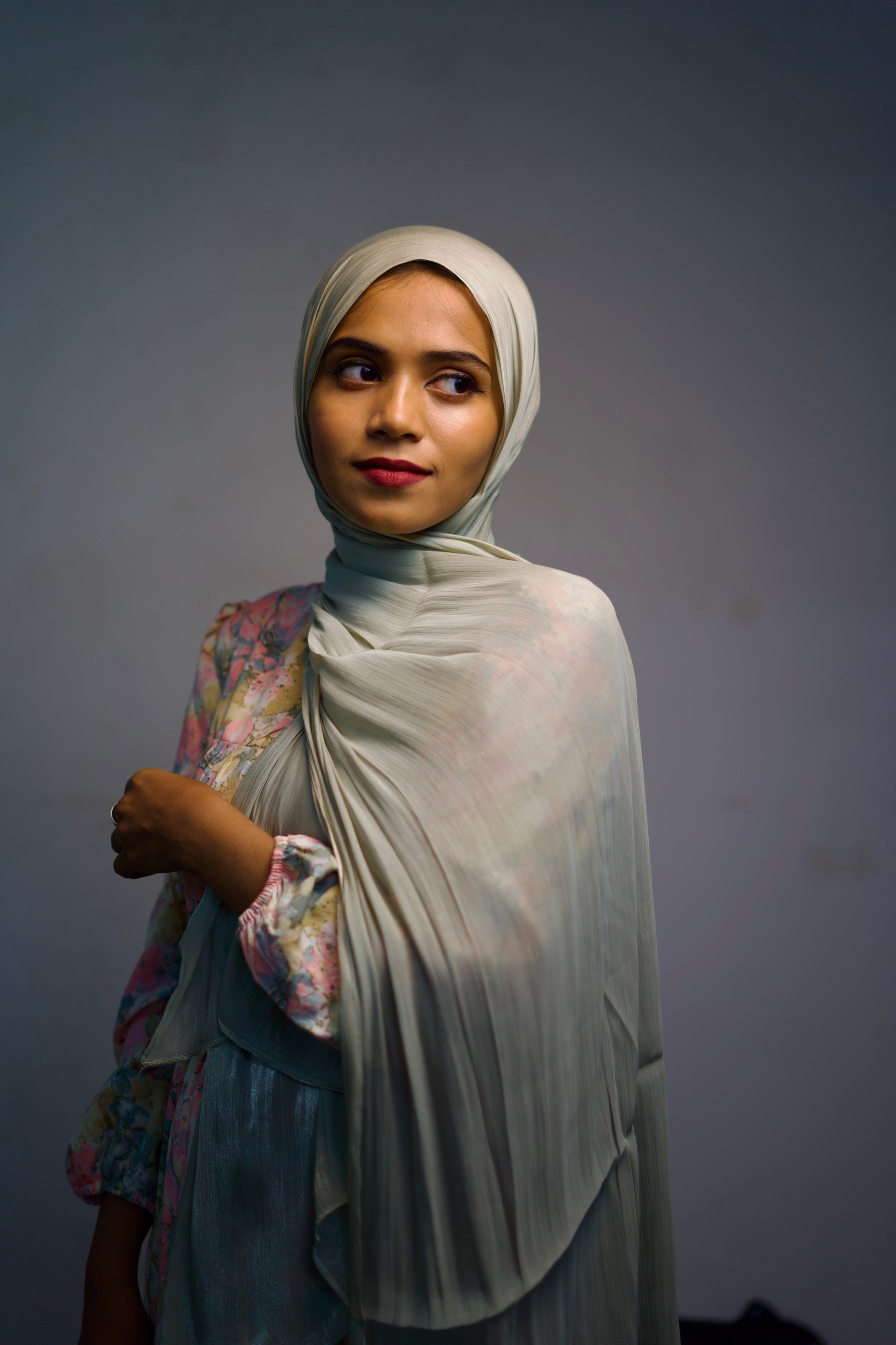 Woman in an Artichoke Shimmer Hijab with a clean and polished style.