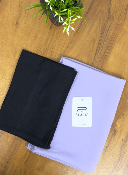 Soft lavender hijab with a bold black cap for contrast.
