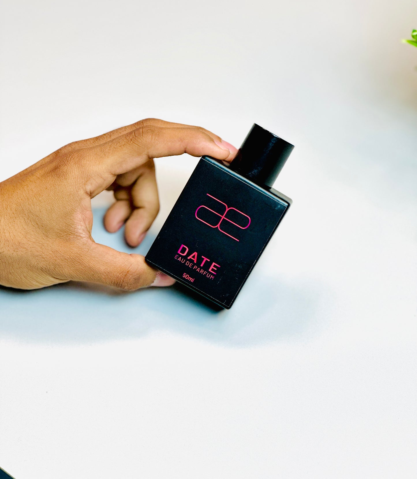 Person holding Blaek Date Perfume (50ml) against a clean background.