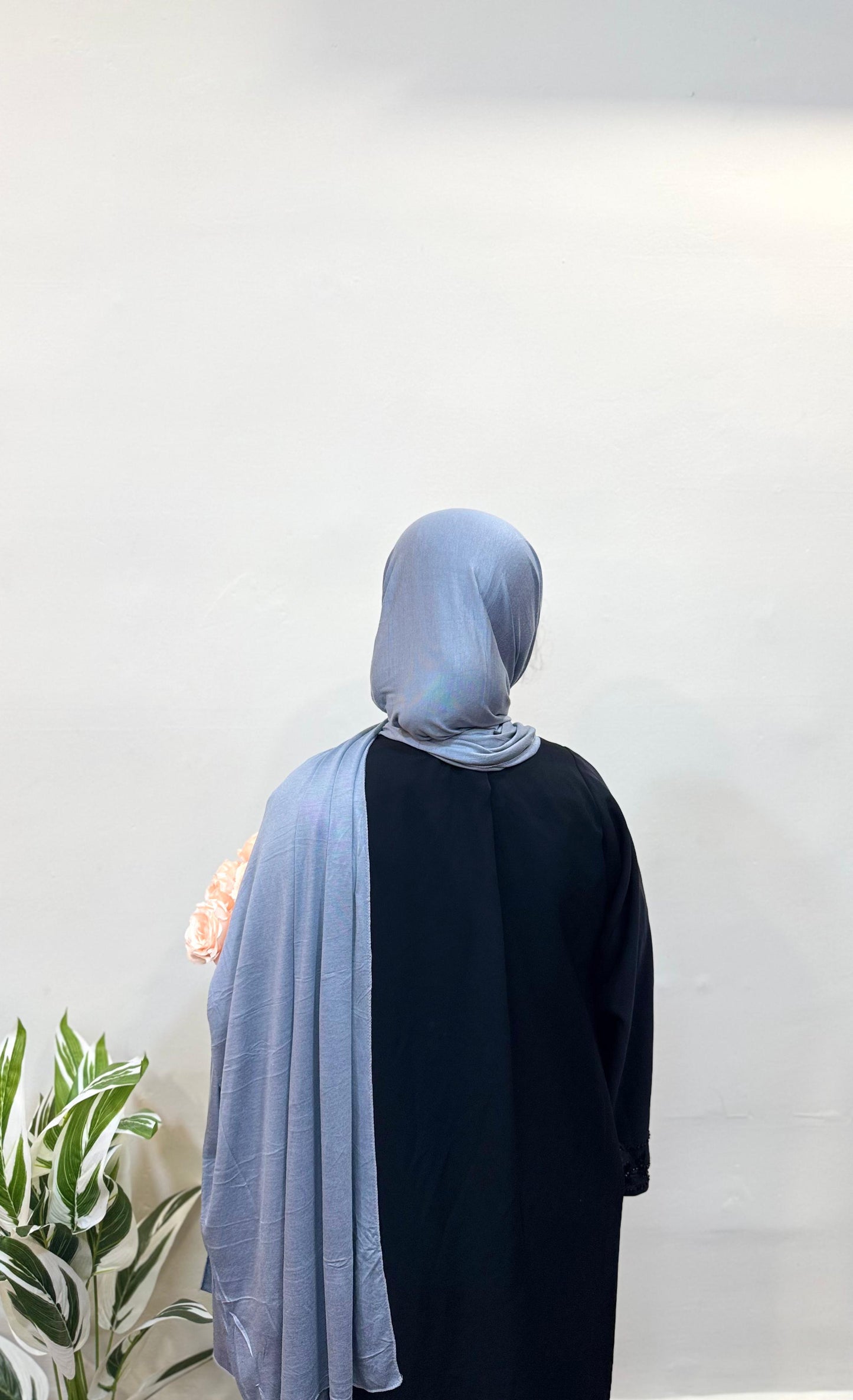 Woman wearing a blue gray jersey hijab