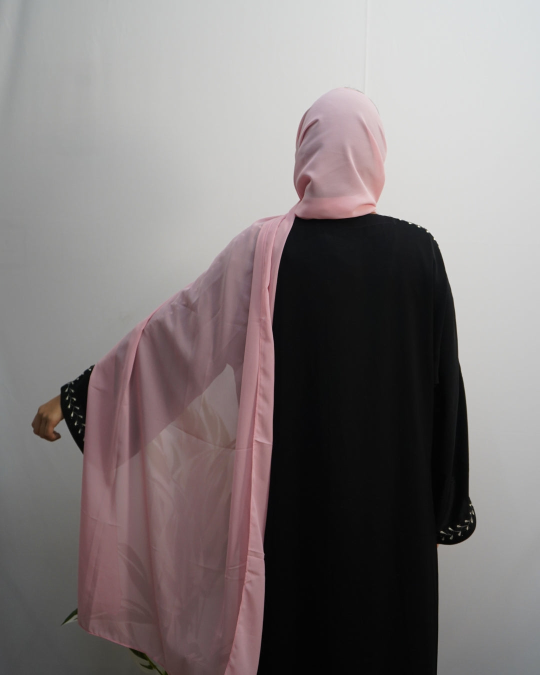 Soft blush pink indian hijab with smooth finish and neat edges.