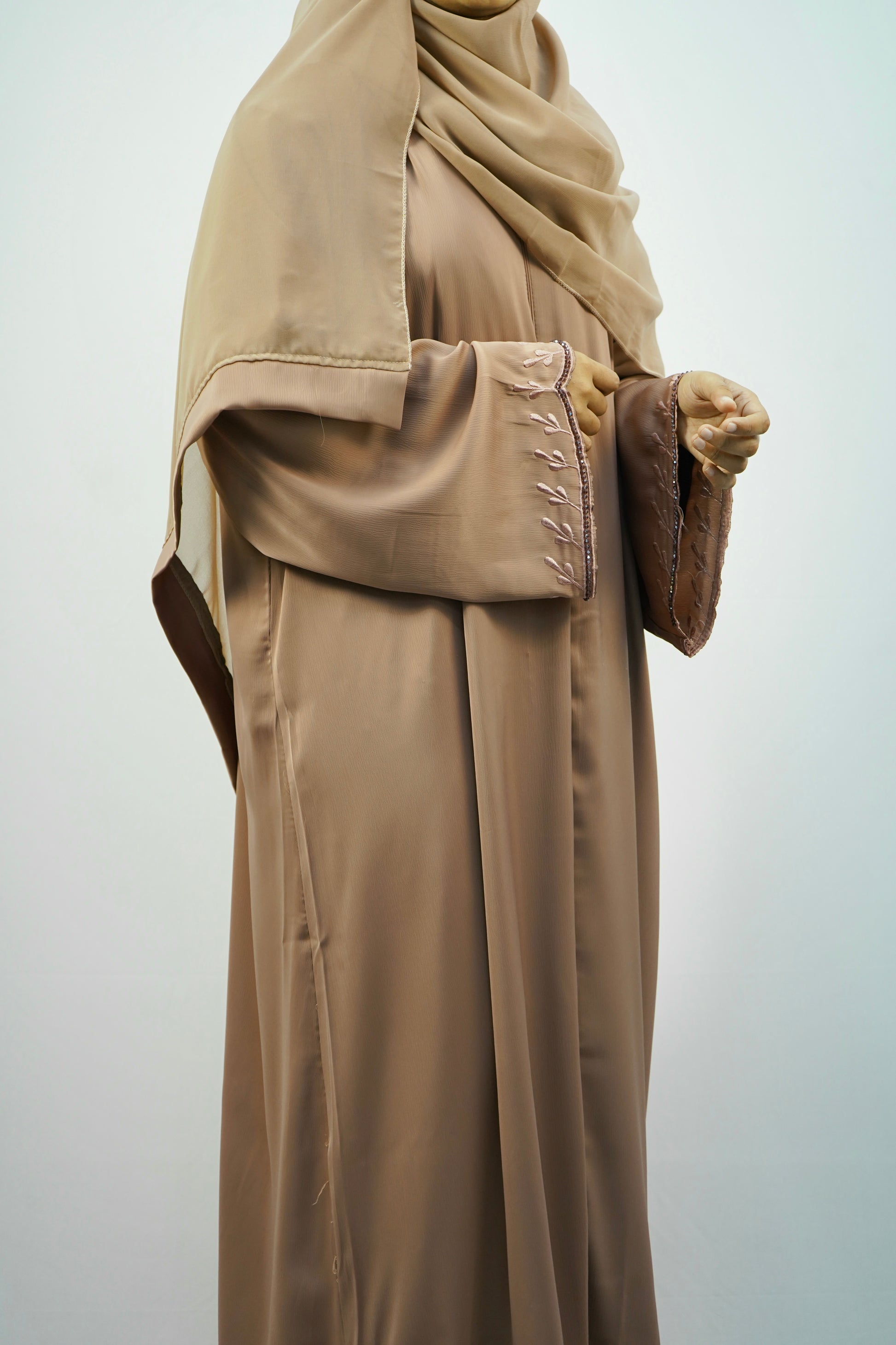 A woman elegantly wearing the Tiktok Indonesian Abaya, showcasing its beautiful drape and comfortable fit.