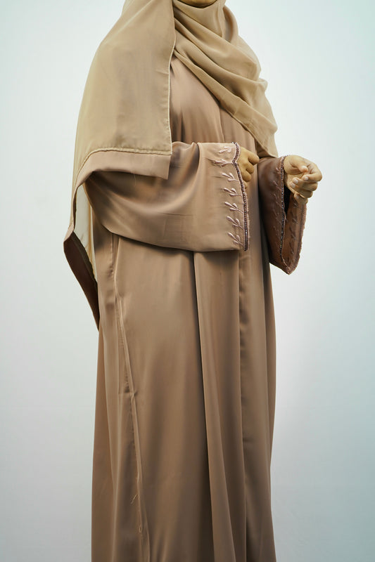 A woman elegantly wearing the Tiktok Indonesian Abaya, showcasing its beautiful drape and comfortable fit.