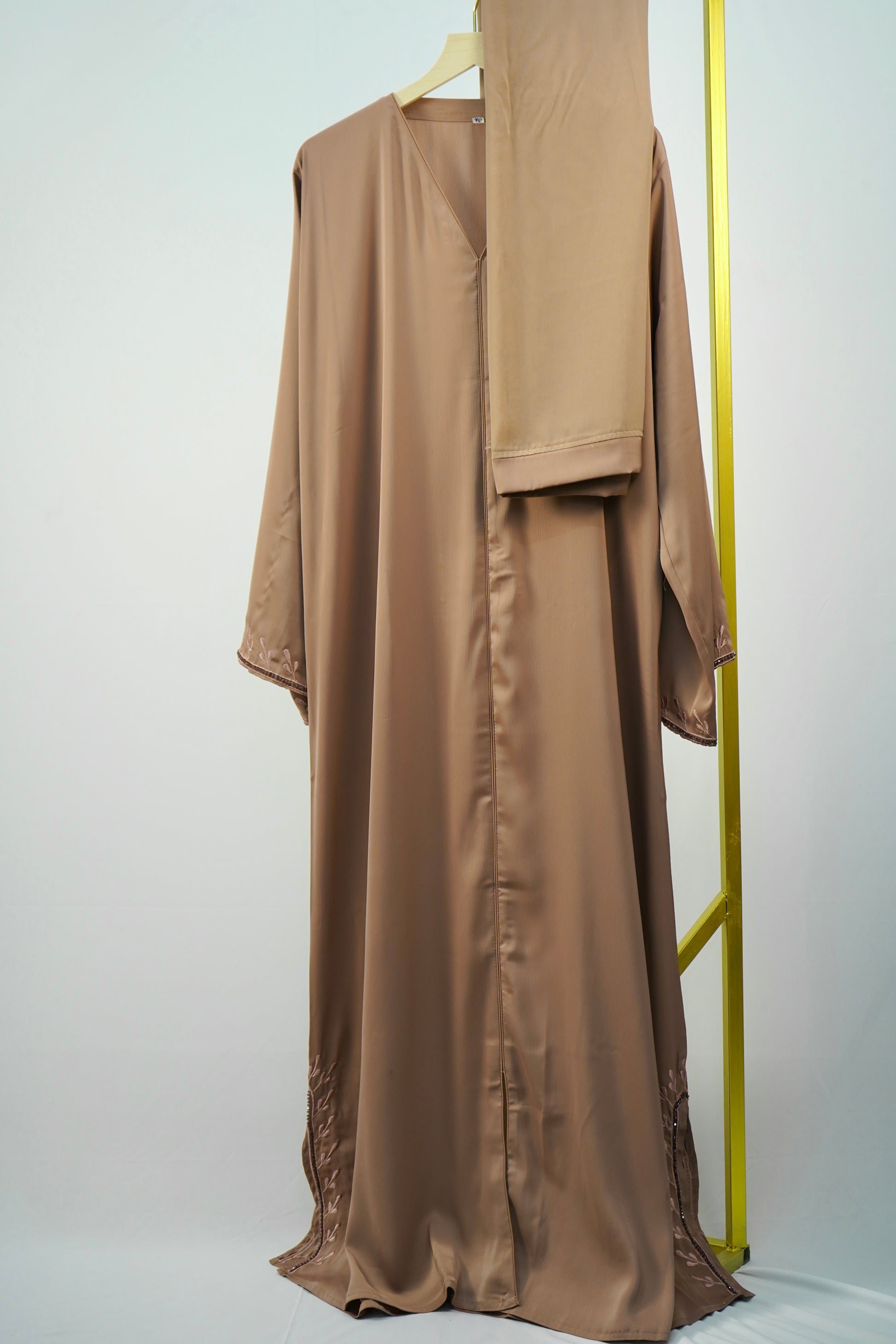 A full-length view of the elegant Tiktok Indonesian Abaya - Brown, showcasing its overall silhouette and the matching scarf.