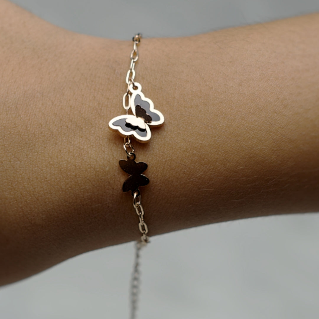 Delicate butterfly bracelet with an adjustable chain and elegant charm.