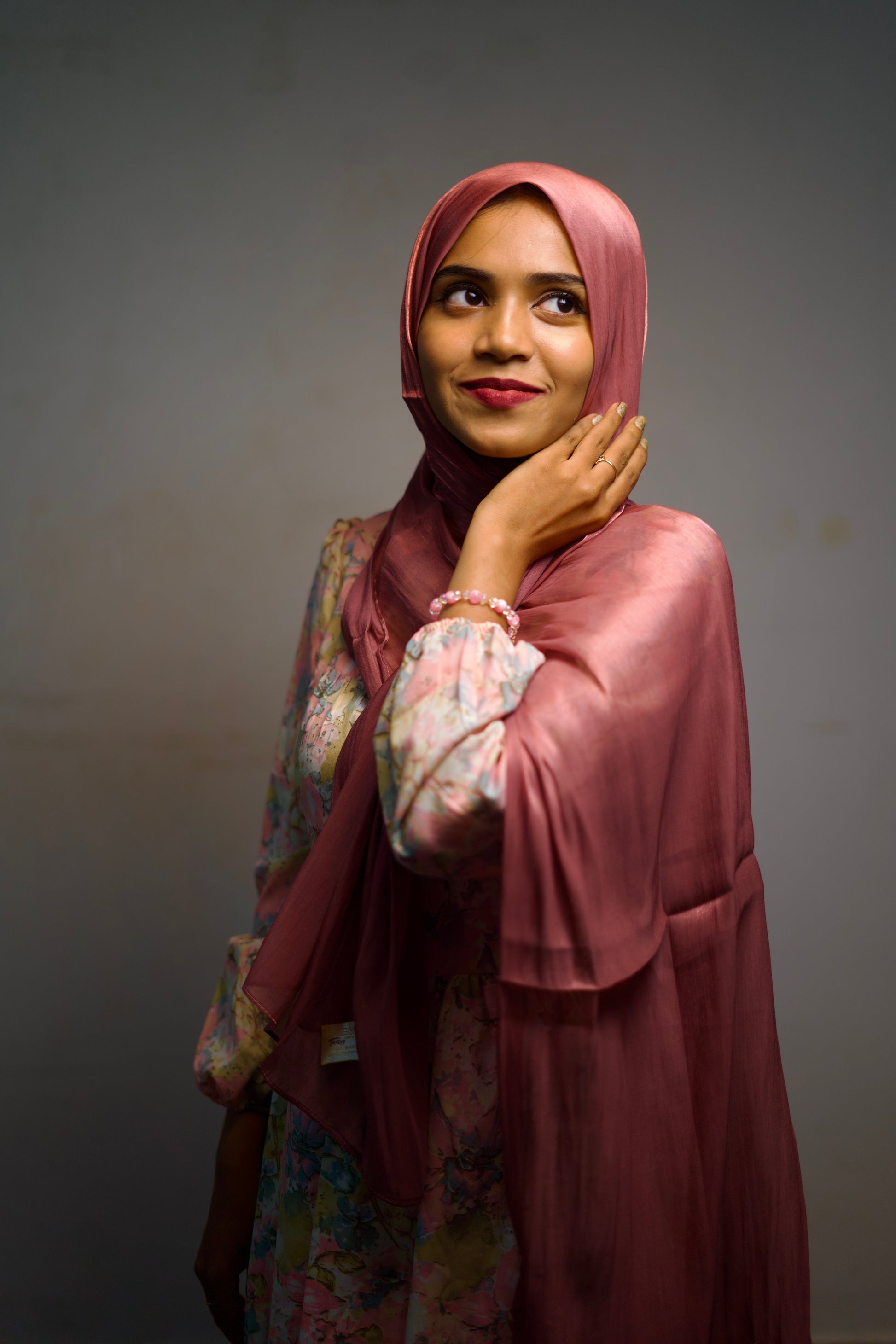 Bold candy shimmer scarf wrapped neatly, radiating charm and shine.