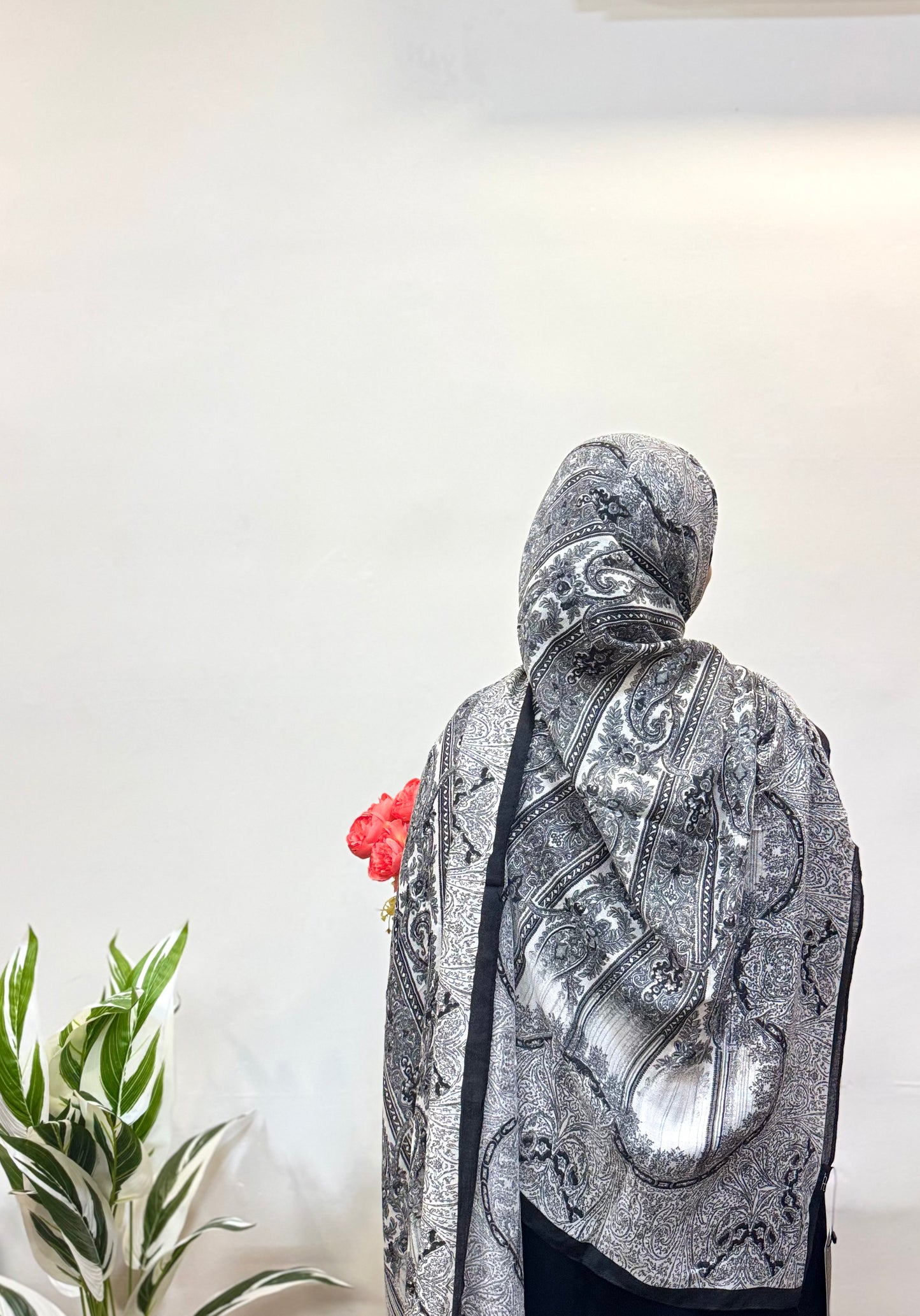 Carbon black pashmina hijab, soft and breathable, adding a sleek, stylish touch to any look.