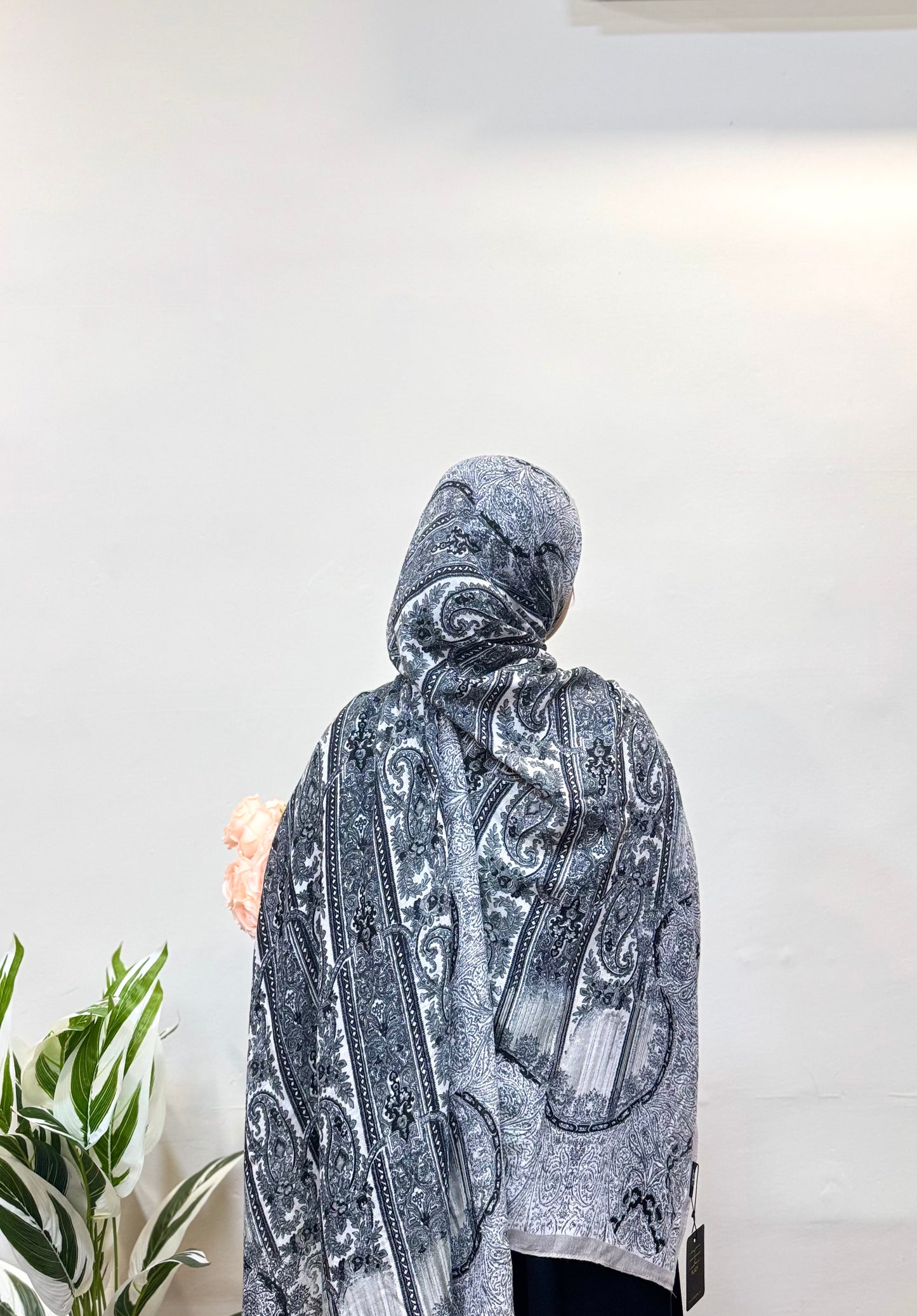 Charcoal grey pashmina hijab with a smooth, breathable texture, offering all-day comfort and a sleek, modern look that complements both casual and formal outfits.