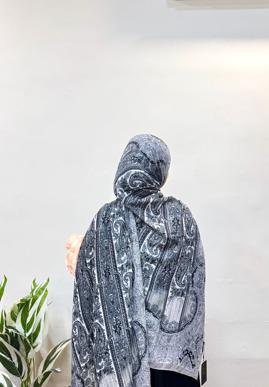 Charcoal grey pashmina hijab with a smooth, breathable texture, offering all-day comfort and a sleek, modern look that complements both casual and formal outfits.