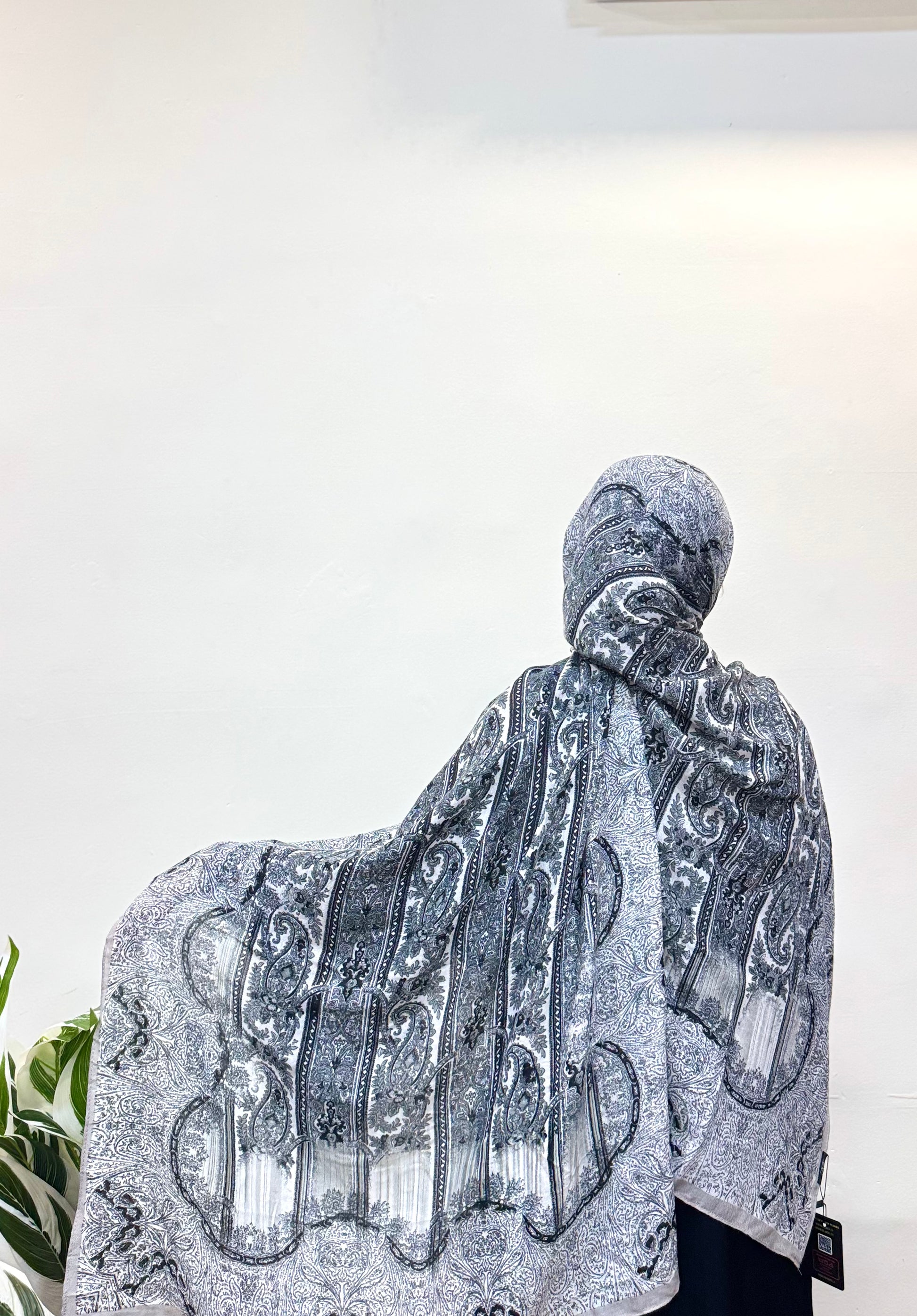 Charcoal grey pashmina hijab with a smooth, breathable texture, offering all-day comfort and a sleek, modern look that complements both casual and formal outfits.