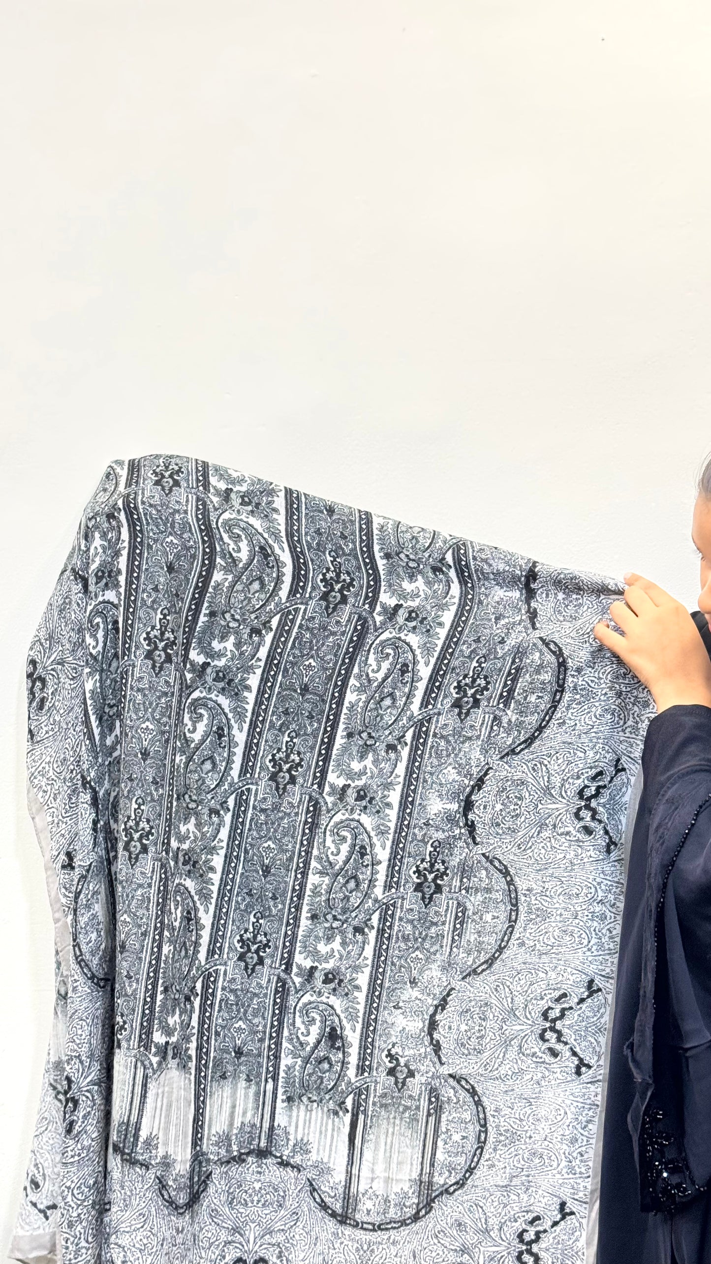 Charcoal grey pashmina hijab with a smooth, breathable texture, offering all-day comfort and a sleek, modern look that complements both casual and formal outfits.