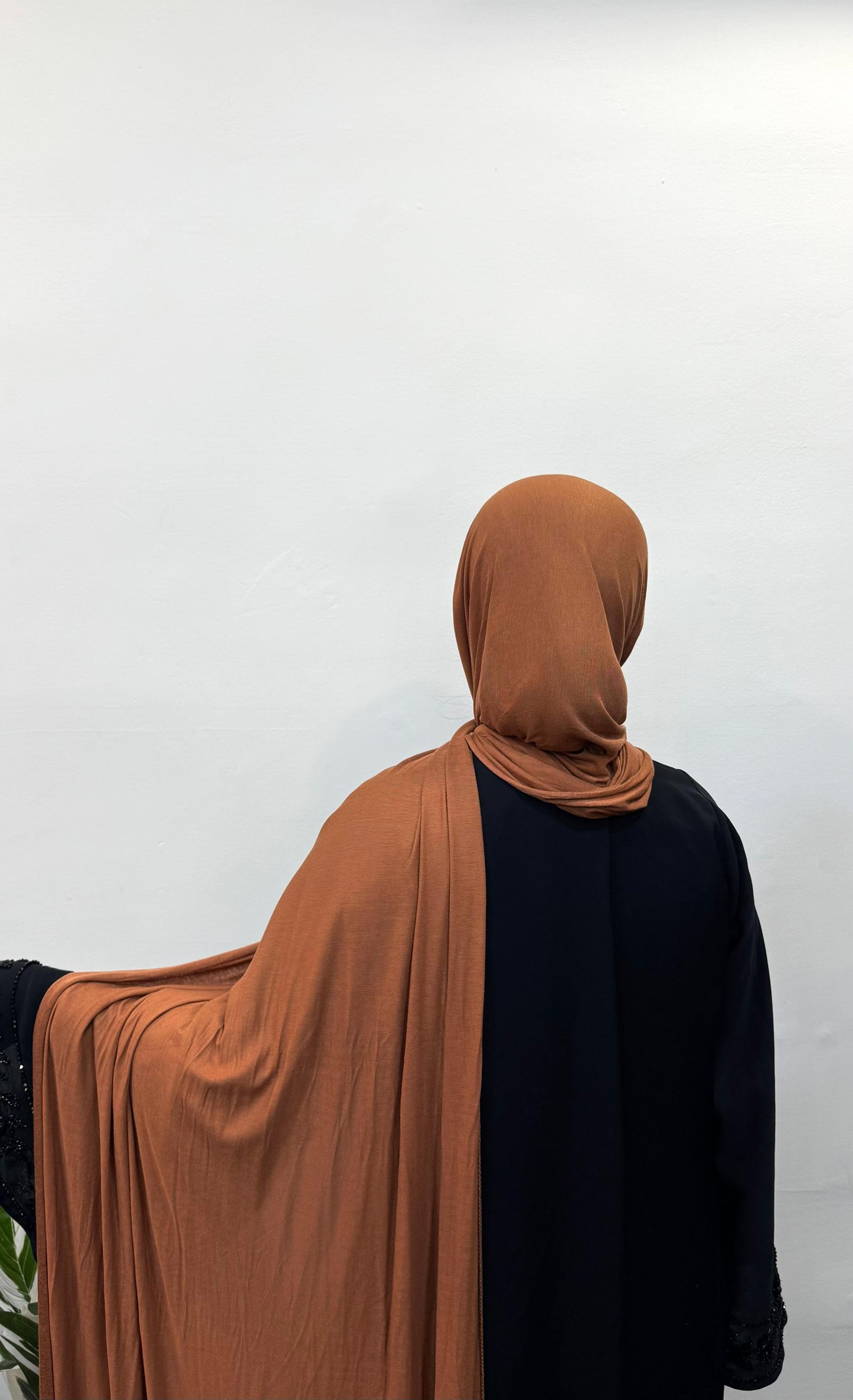 Copper jersey hijab styled in a simple wrap.