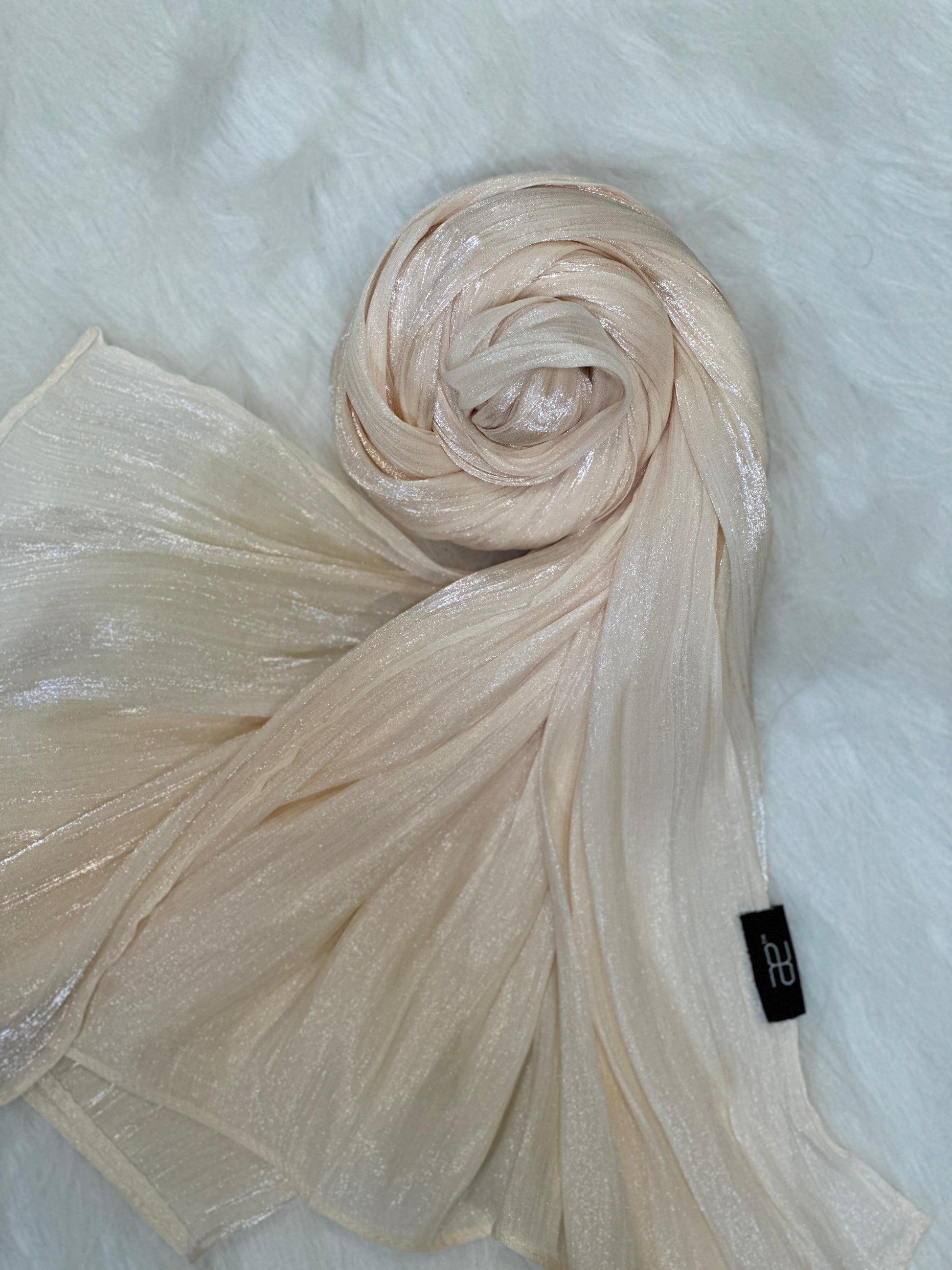 Round-shaped chiffon scarf in cornsilk, with layered shimmer detailing.