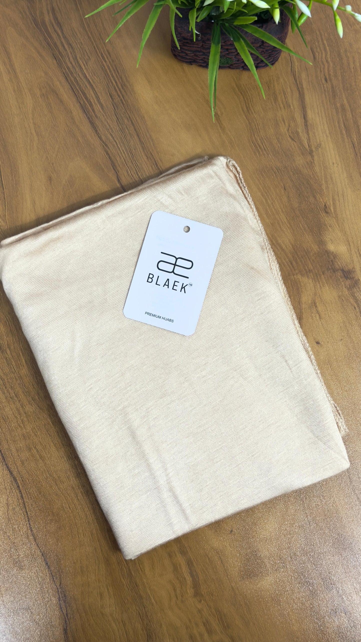 Lightweight cream hijab in breathable jersey fabric.