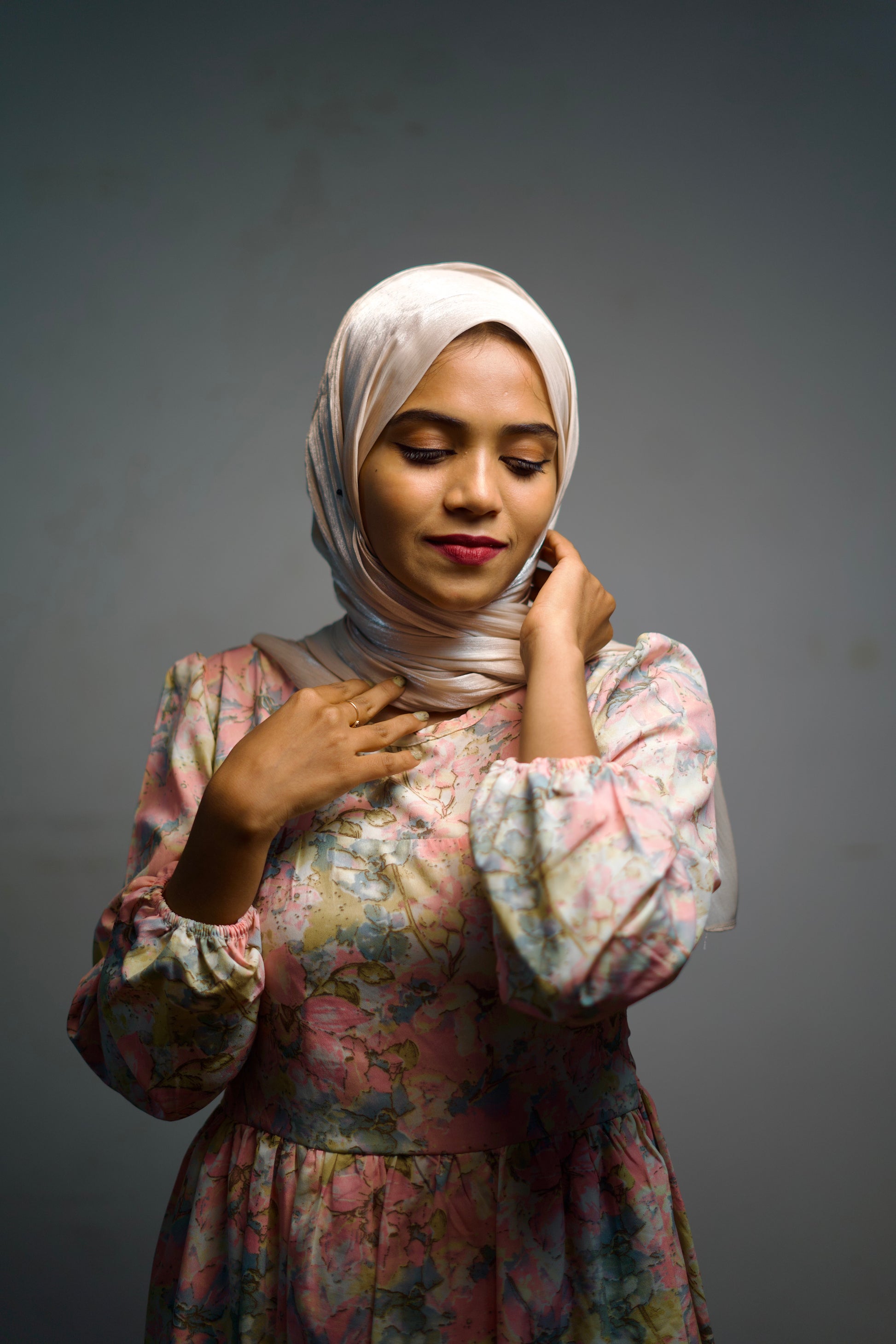 Cream shimmer hijab draped naturally with light shine.