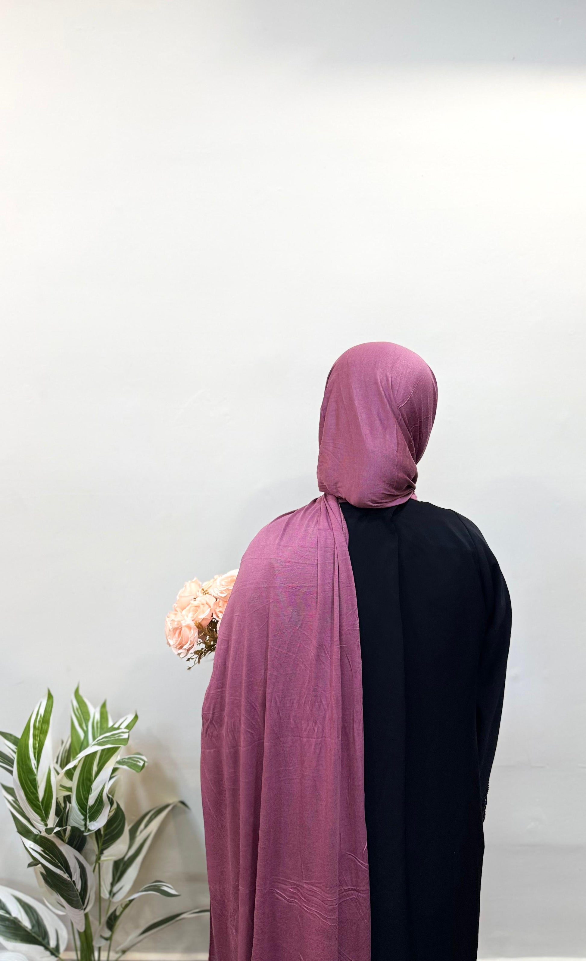 Back view of dark pink jersey hijab flowing over shoulders.