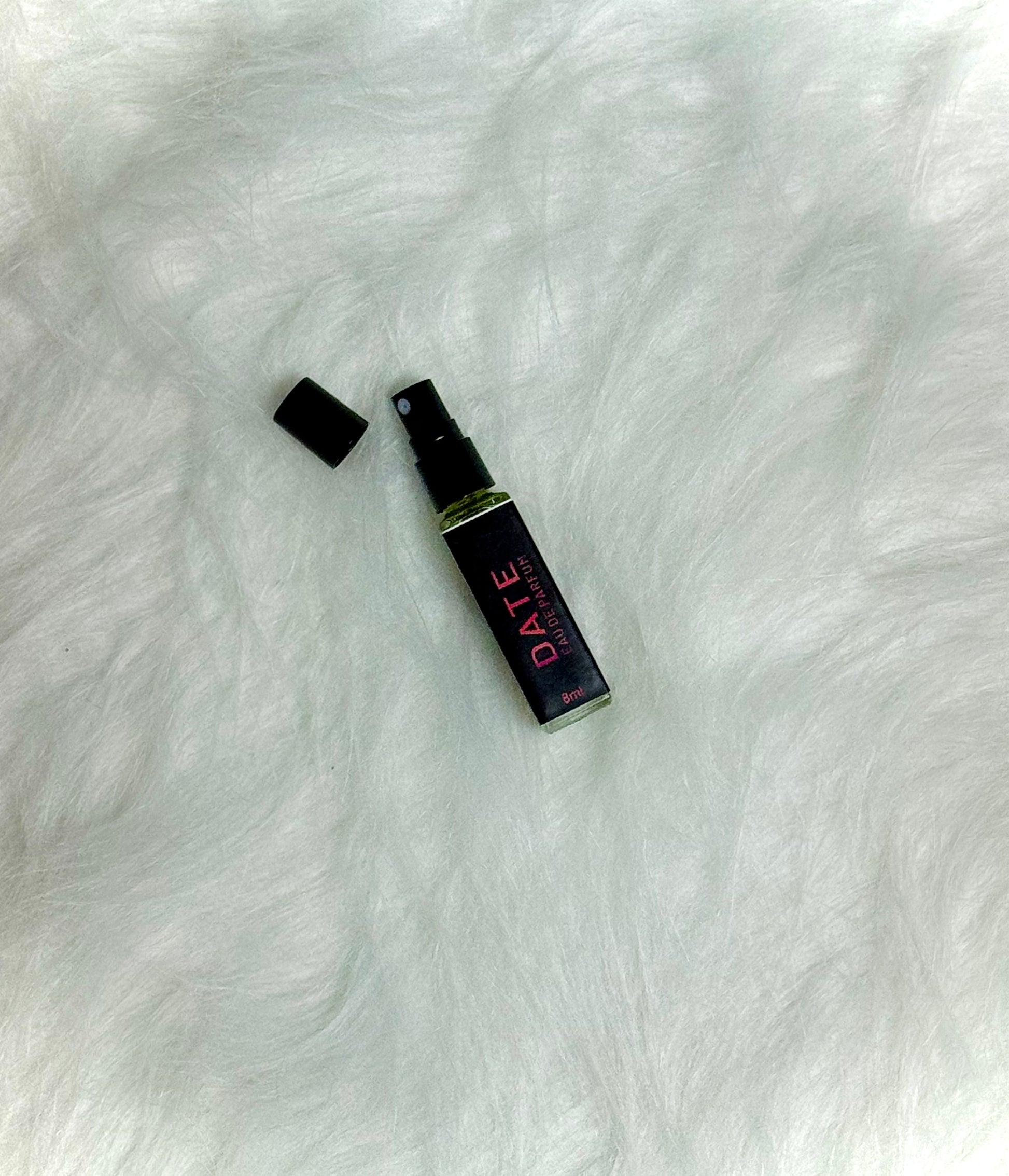 Top view of Date Perfume 8ml placed on a plain white background.