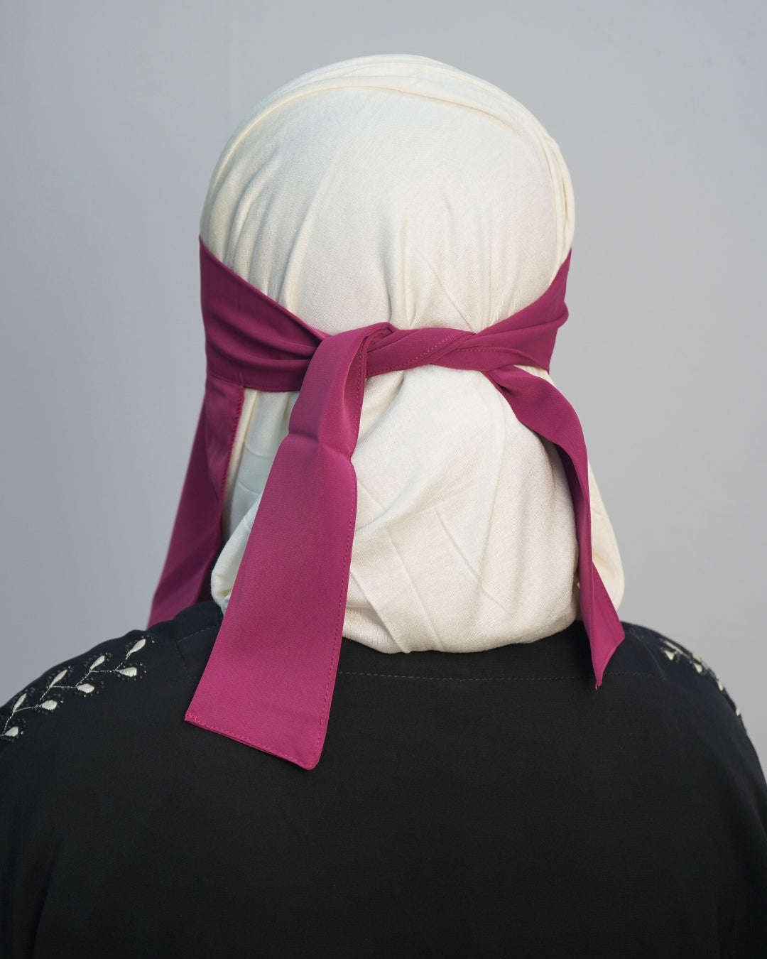 Back view of deep magenta niqab showing tied straps.