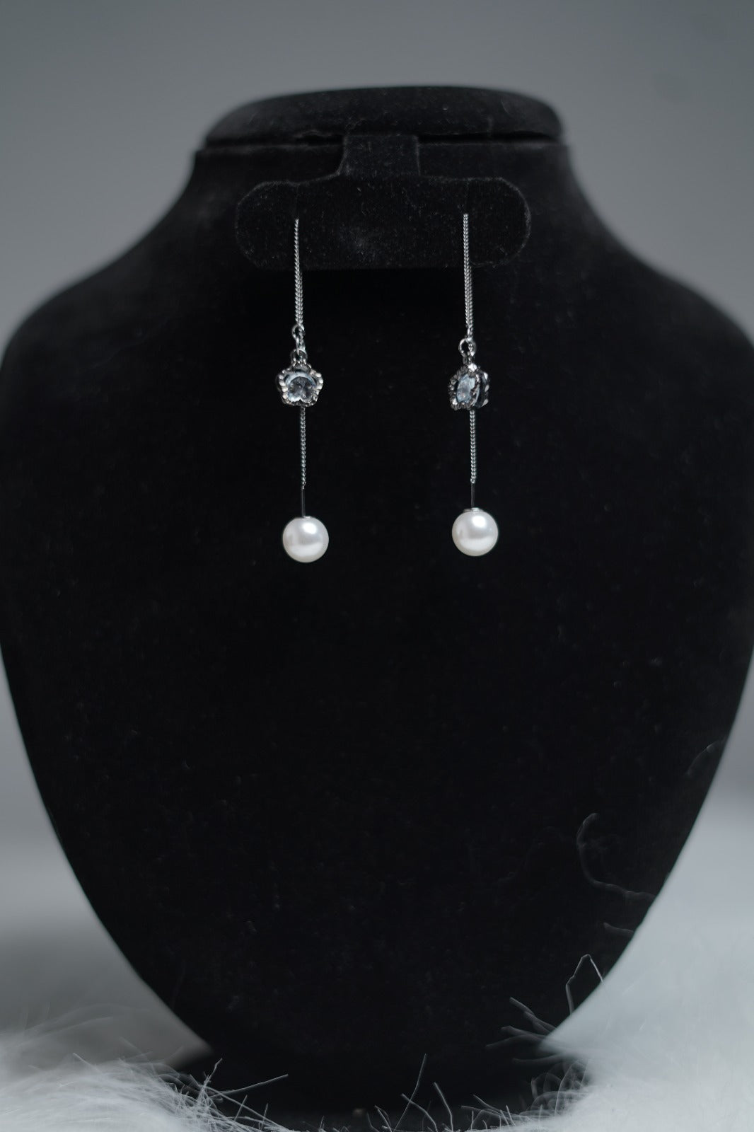 Antique silver threader earrings with pearl and floral charm.