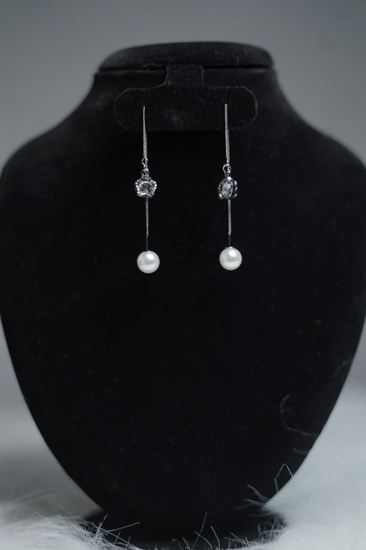 Antique silver threader earrings with pearl and floral charm.