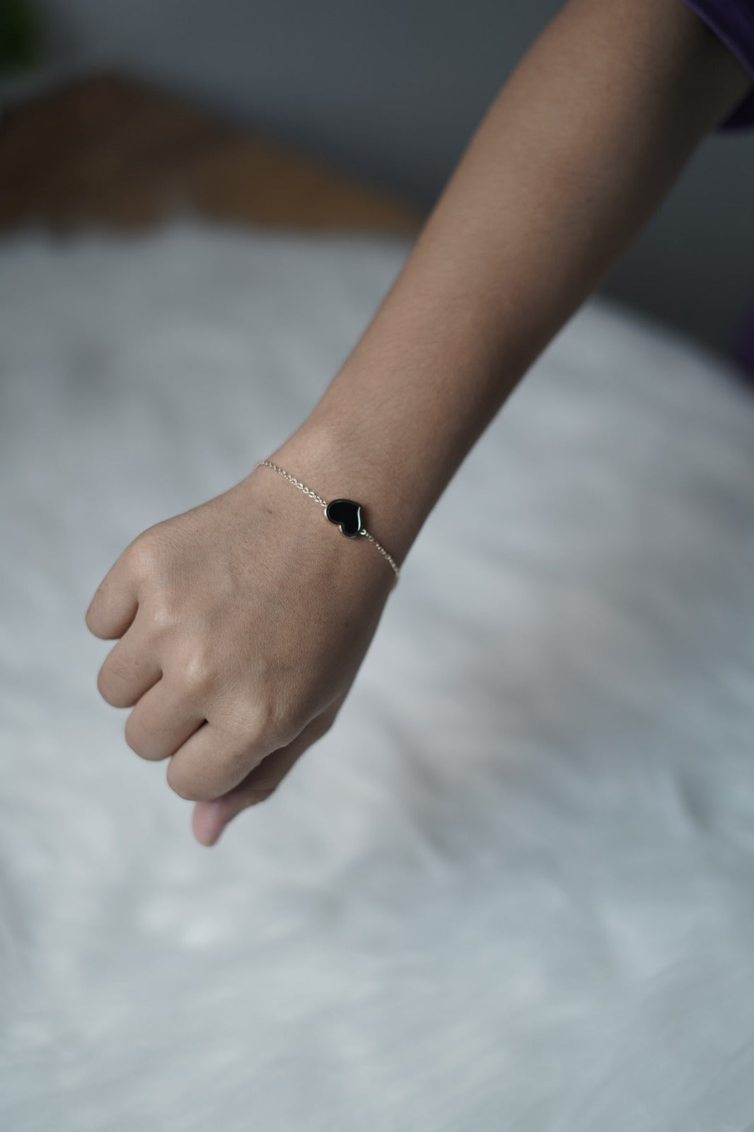 Close view of the black heart side, showing its glossy, smooth surface.