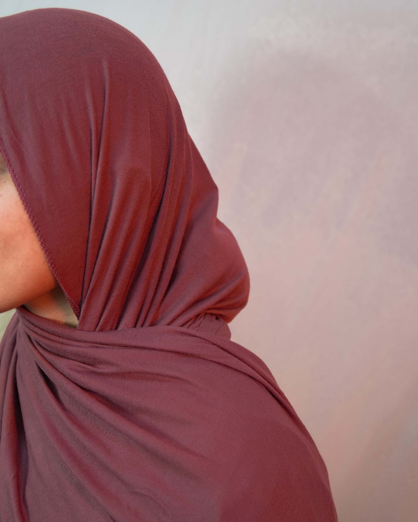 Close up dusty mauve jersey hijab fabric soft stretch jersey texture premium modest hijab