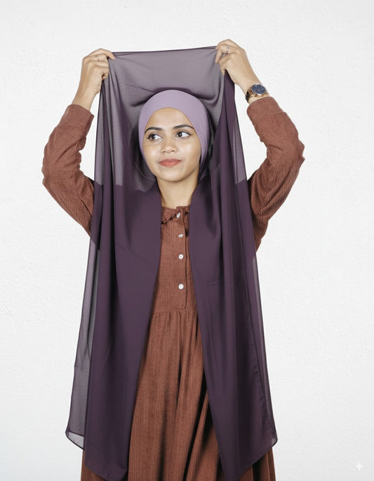 Woman wearing eggplant instant hijab with lavender cap, ready-to-wear style for modest fashion.