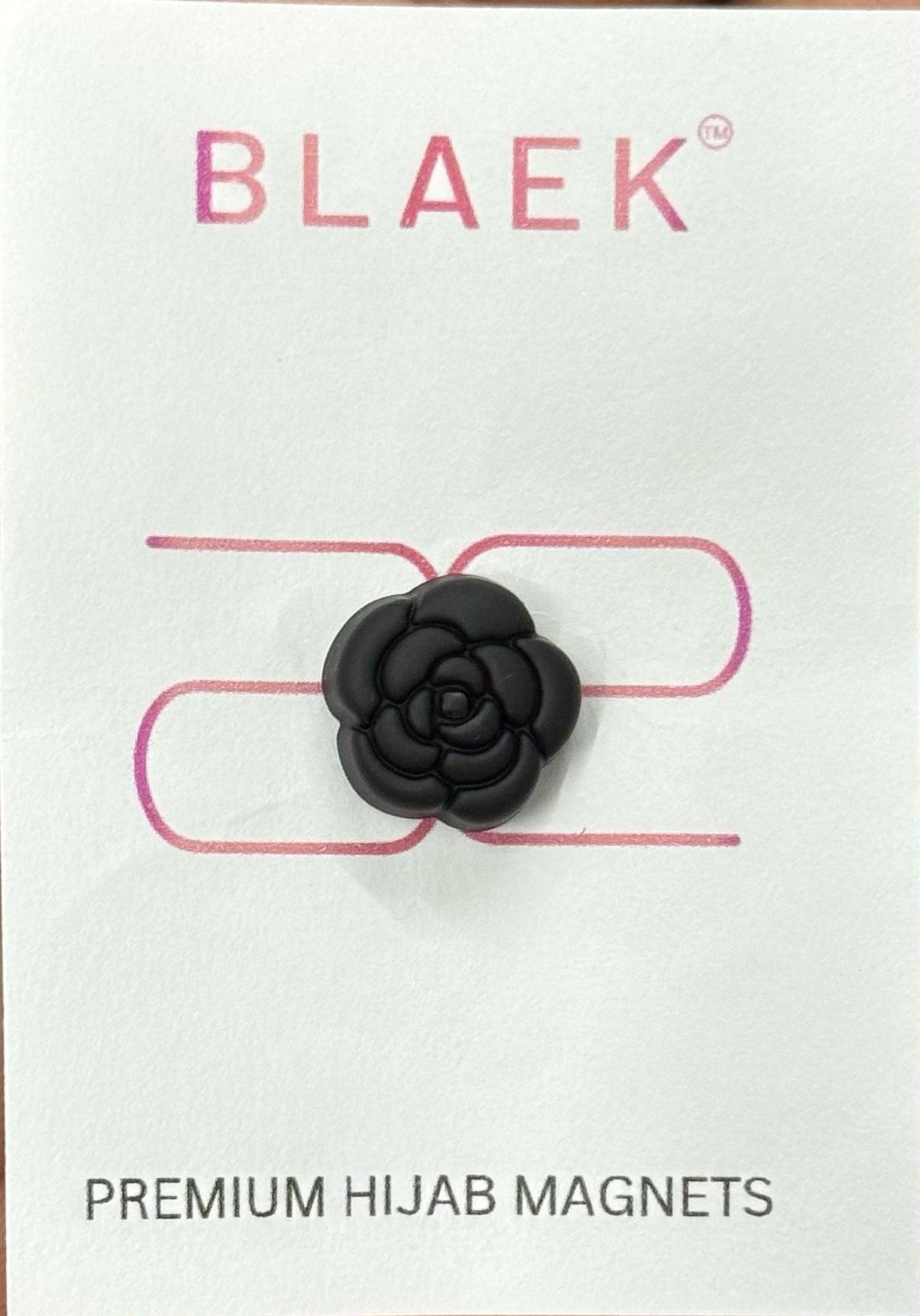 Elegant rose-shaped hijab magnet with a delicate floral design.
