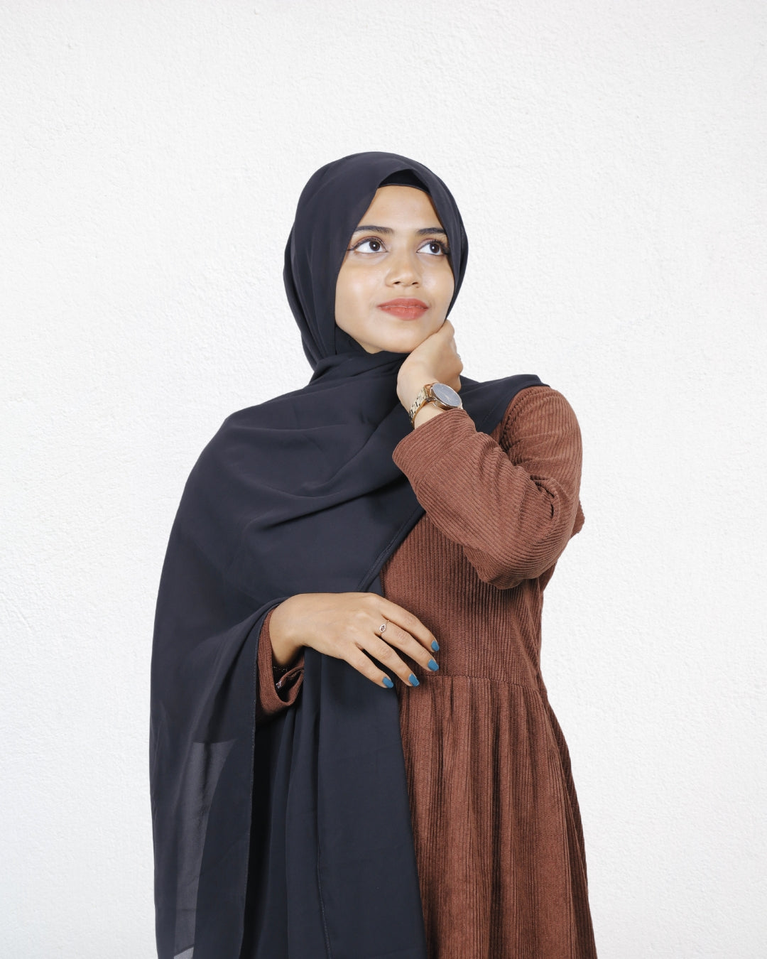 A woman elegantly wearing the Jet Black Instant Hijab, showing its perfect drape and flowing chiffon.