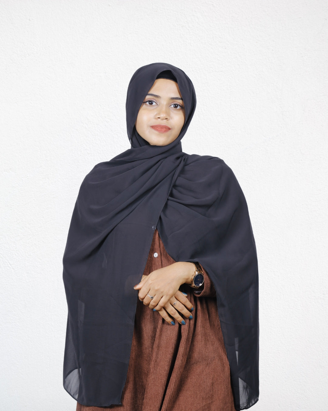 Jet Black Instant Hijab with soft fabric draped around the face.