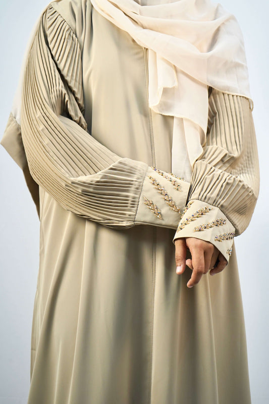 A detailed shot of the pleated sleeve and beaded cuffs of the Korean Alqa Nidha Abaya, with a matching scarf visible.