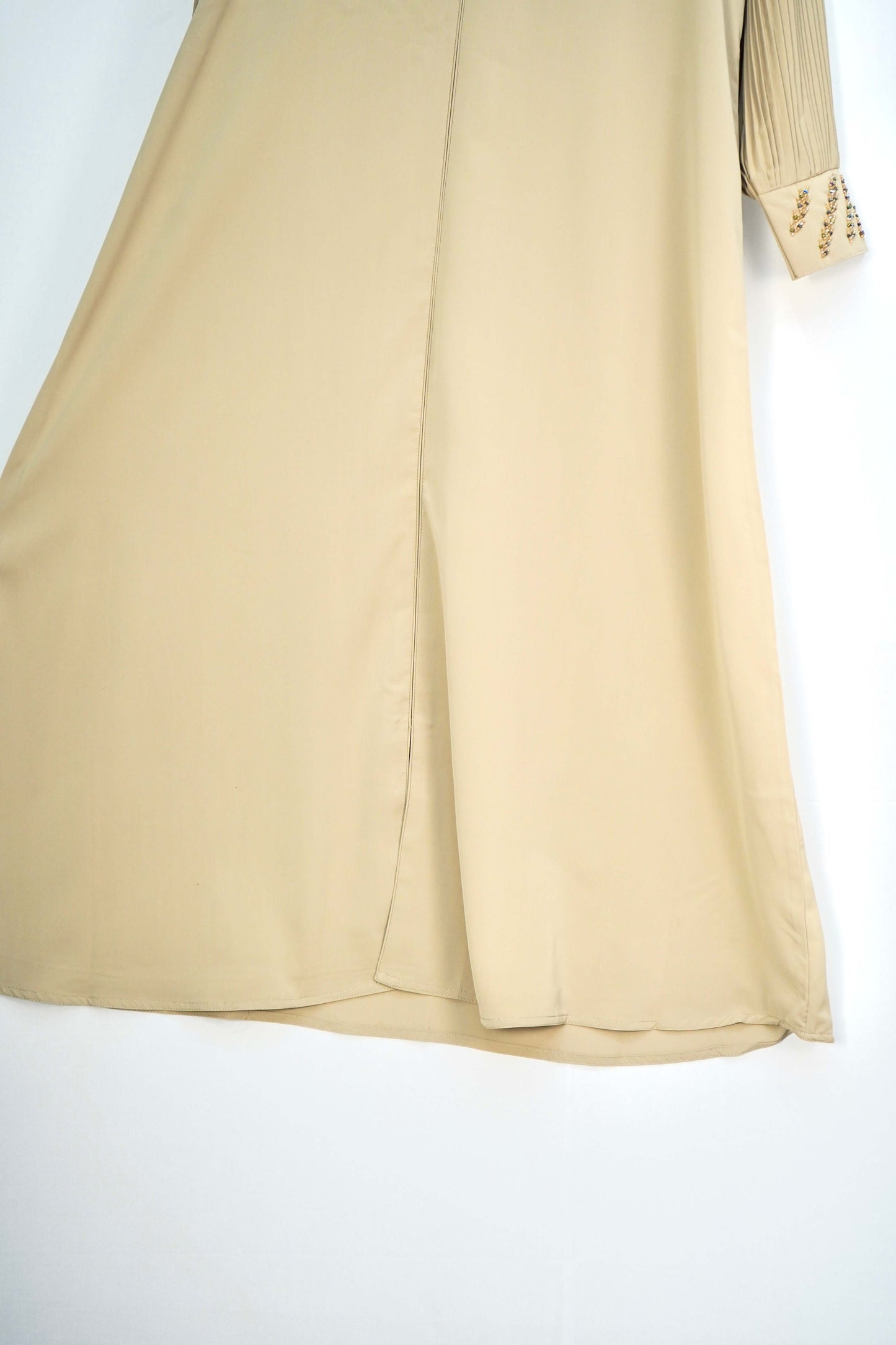 A close-up shot of the silky fabric of the abaya, showing its smooth texture and sheen.