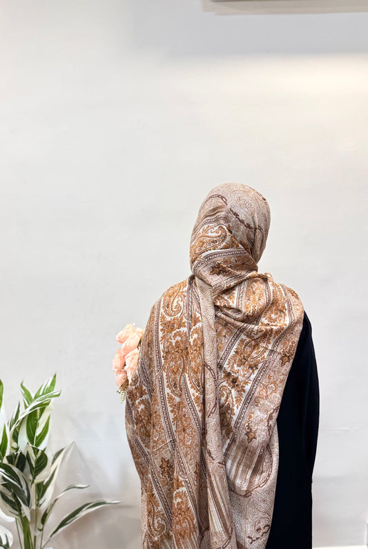Light Brown Pashmina Print Premium Hijab styled in a loose wrap, showing its graceful drape and subtle printed pattern.
