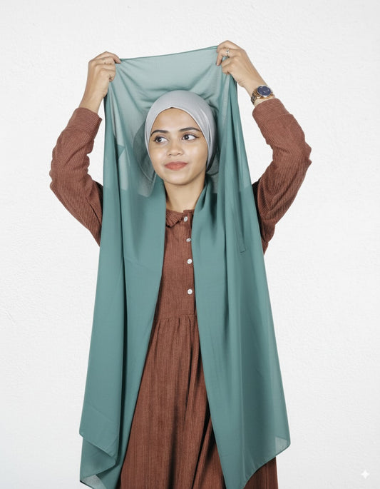 Mint green instant hijab styled with a silver cap in premium chiffon, designed for quick wear and breathable comfort.