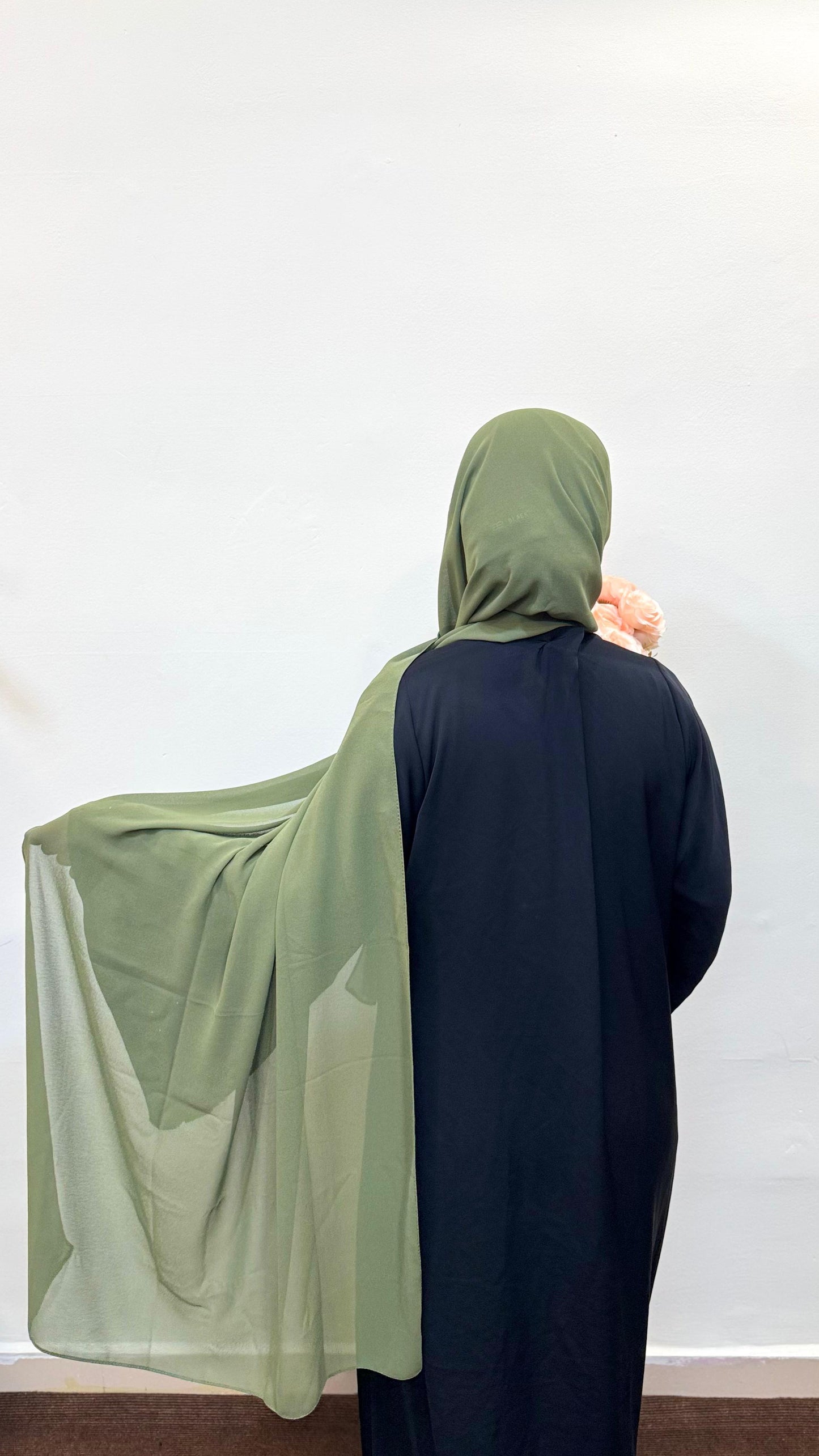 live green scarf with a lightweight flow, adding calm elegance.