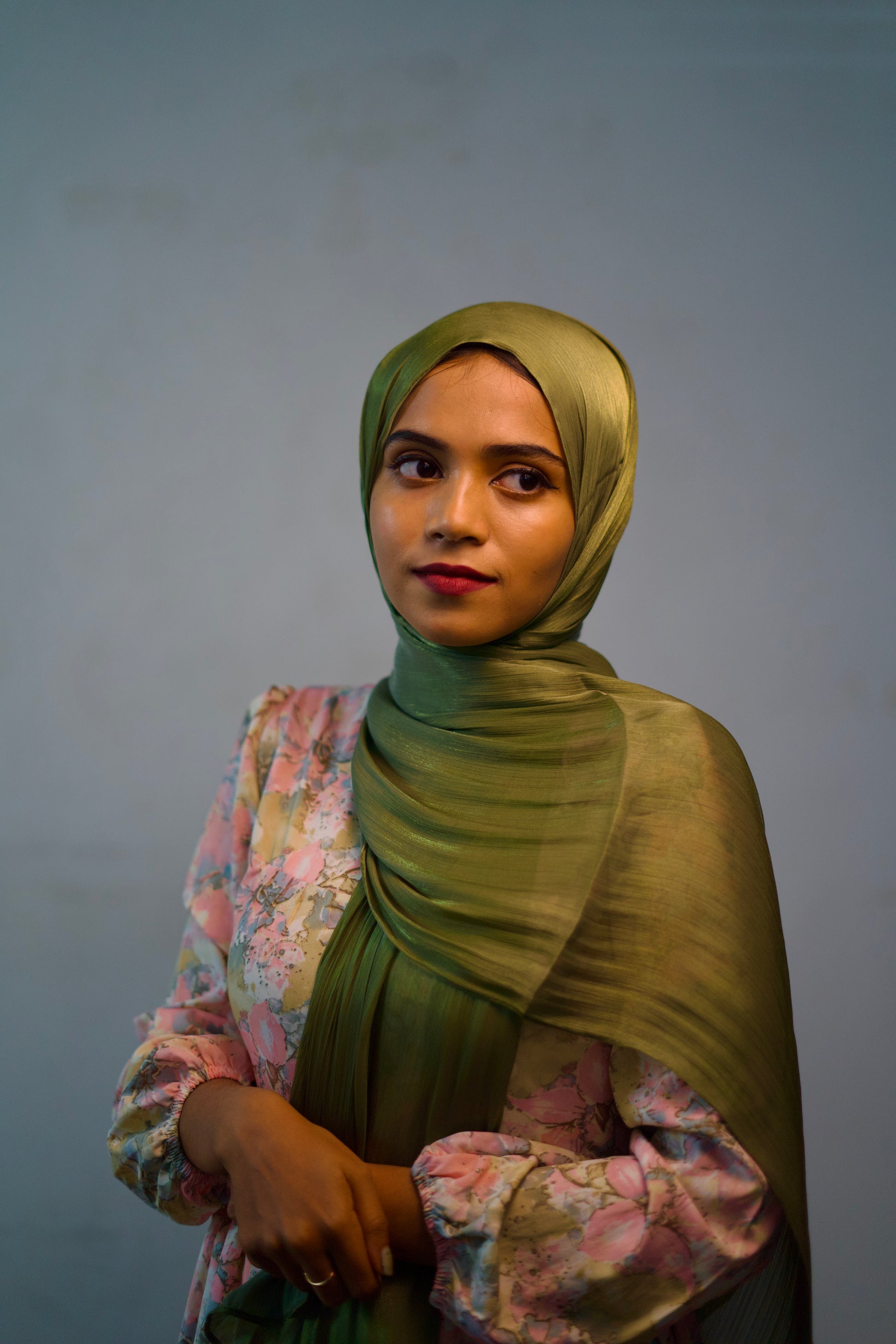 Olive Green Shimmer Hijab worn with soft layers and a calm, modest style.