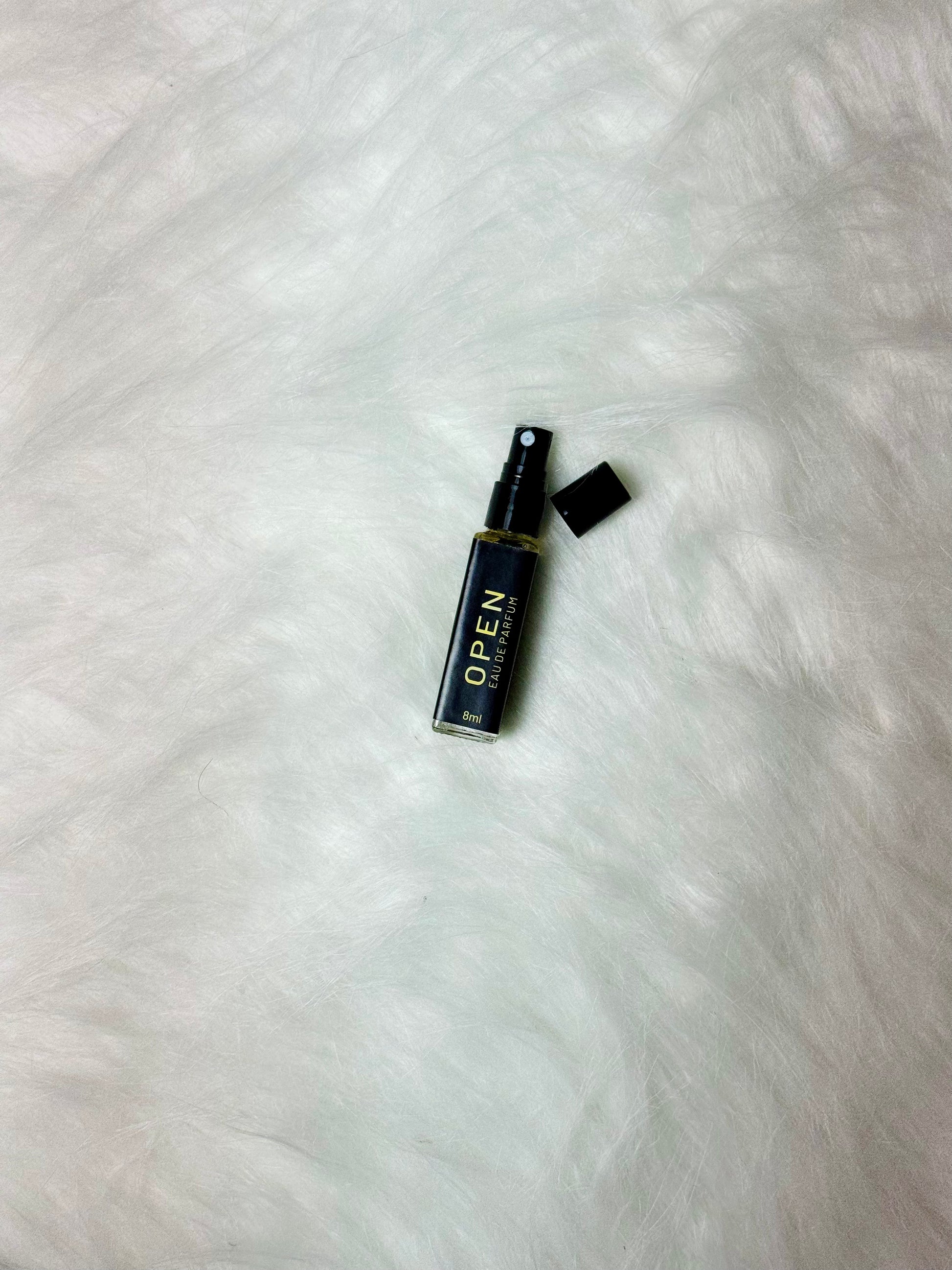 Open Sample 8ml bottle displayed with top open on a plain white background.