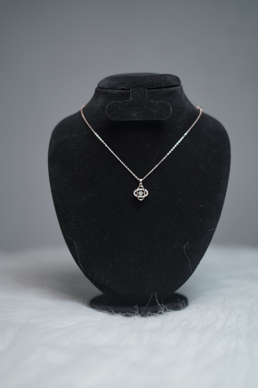 Orbit Luxe Necklace styled on black velvet necklace stand.