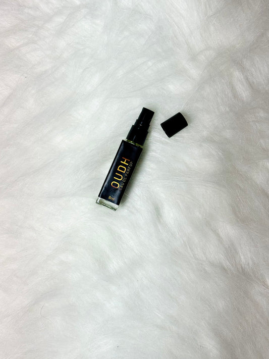 Flat Oudh Perfume 8ml bottle shown with the lid removed on white.