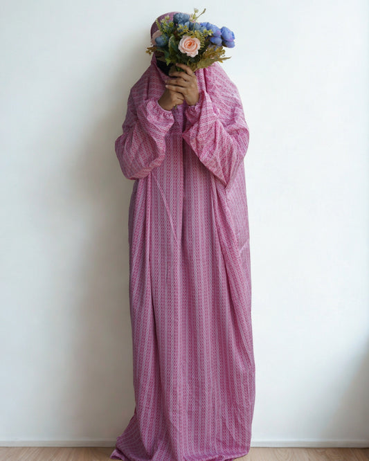 Full-length pink patterned prayer dress with modest design and complete coverage.