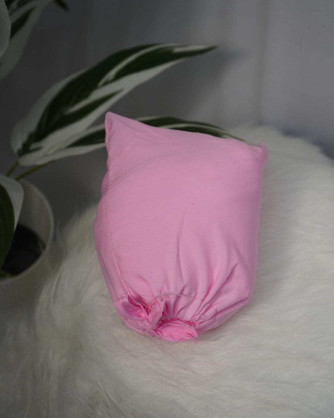 Matching solid pink pouch for Islamic prayer dress.