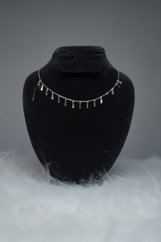 Choker necklace with prism crystal drops shown on display stand.