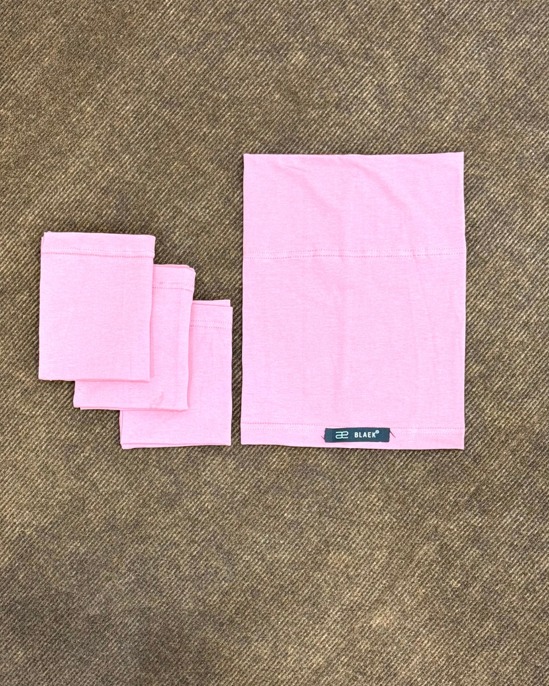 Flat view of puce hijab tube cap.