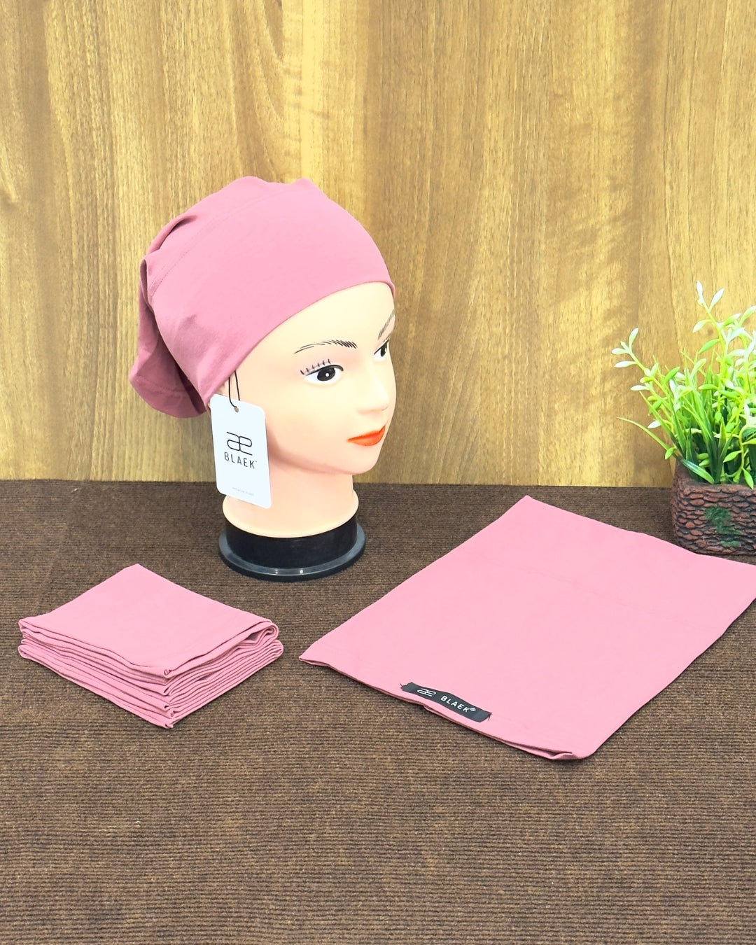 Comfortable puce tube cap on display.