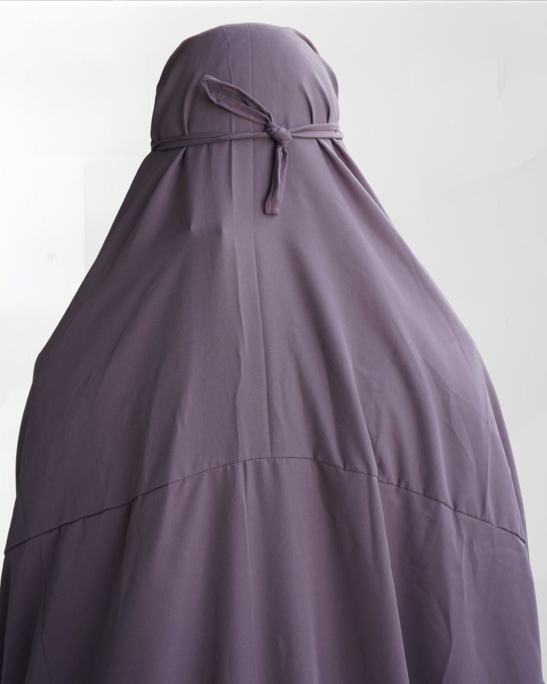 Solid purple polyester lycra prayer dress back view with adjustable tie.