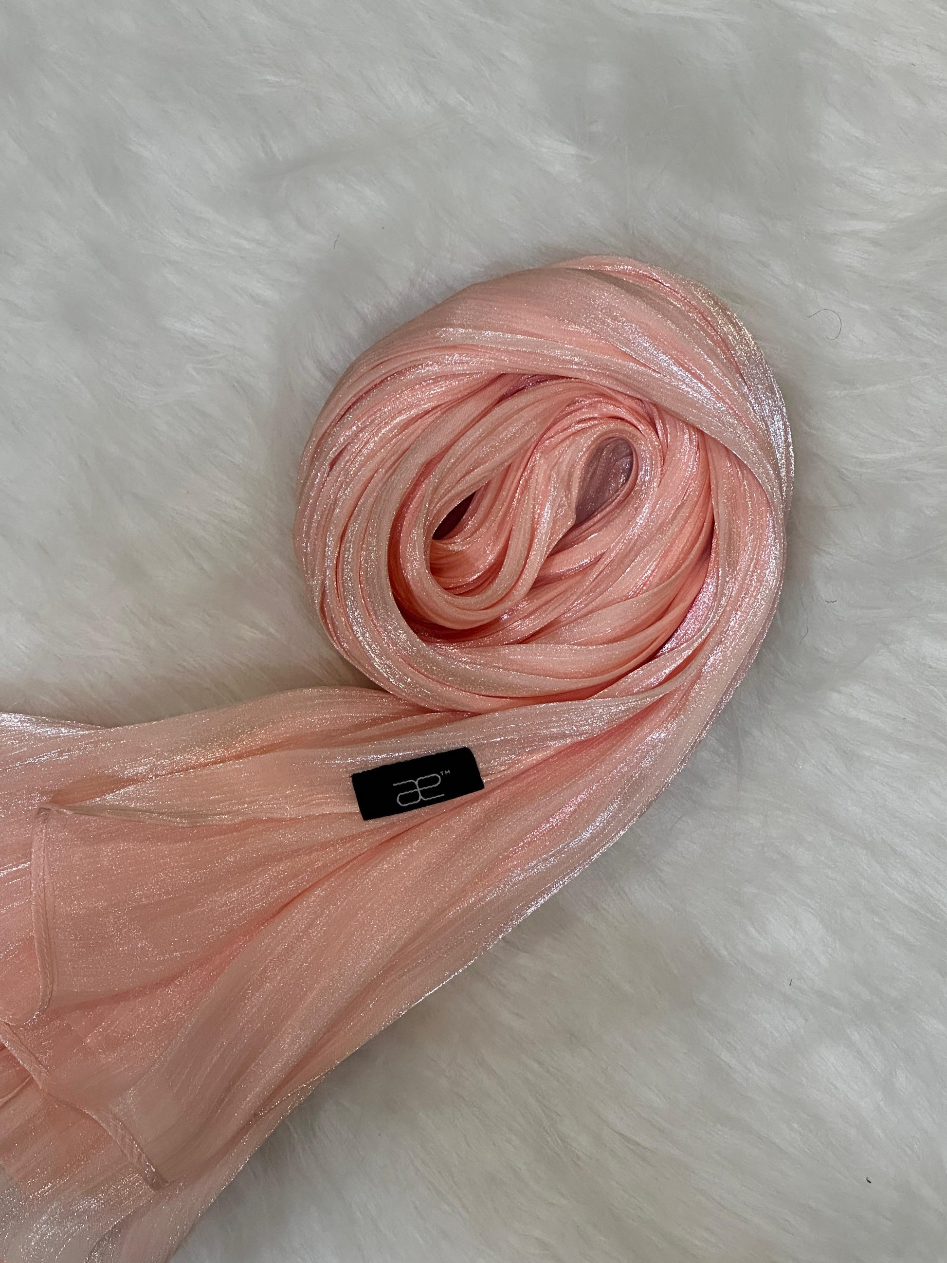 Rose Gold Shimmer Hijab in a round layout showing soft drape and shimmer.