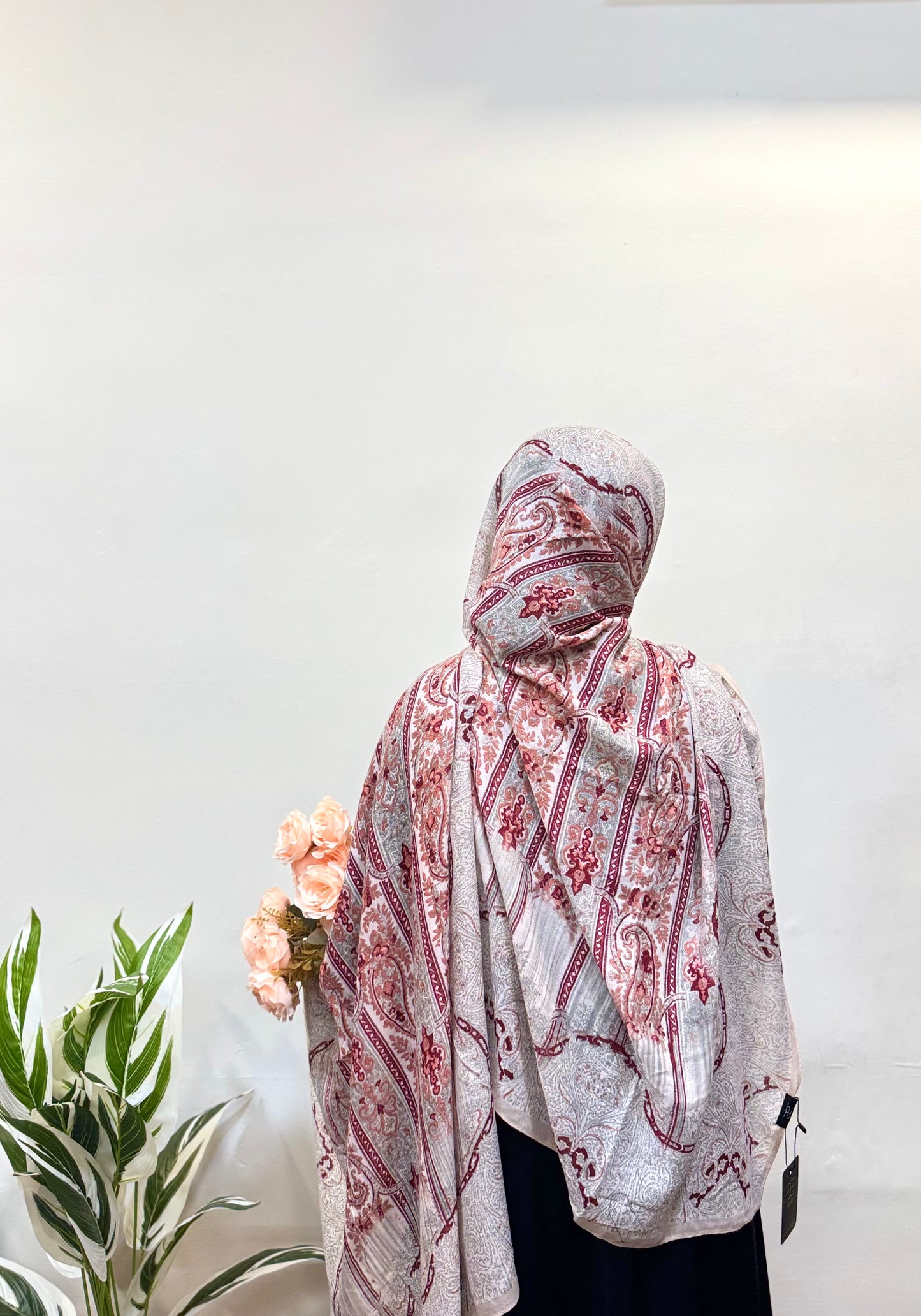Person wearing a Silver - Raspberry Pashmina Print Premium Hijab, showcasing its elegant design.