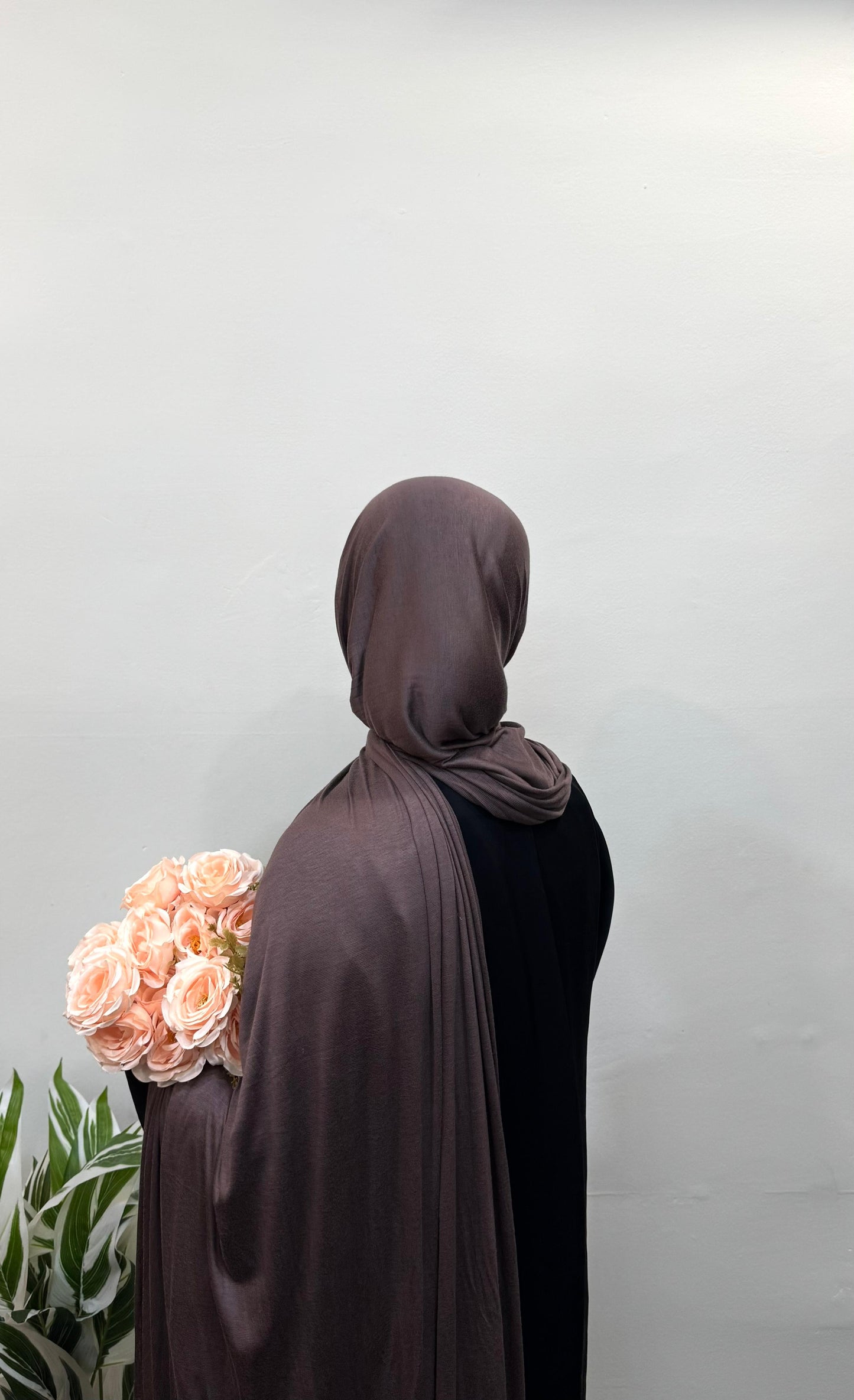 Teddy jersey hijab draped gently around the head and neck.