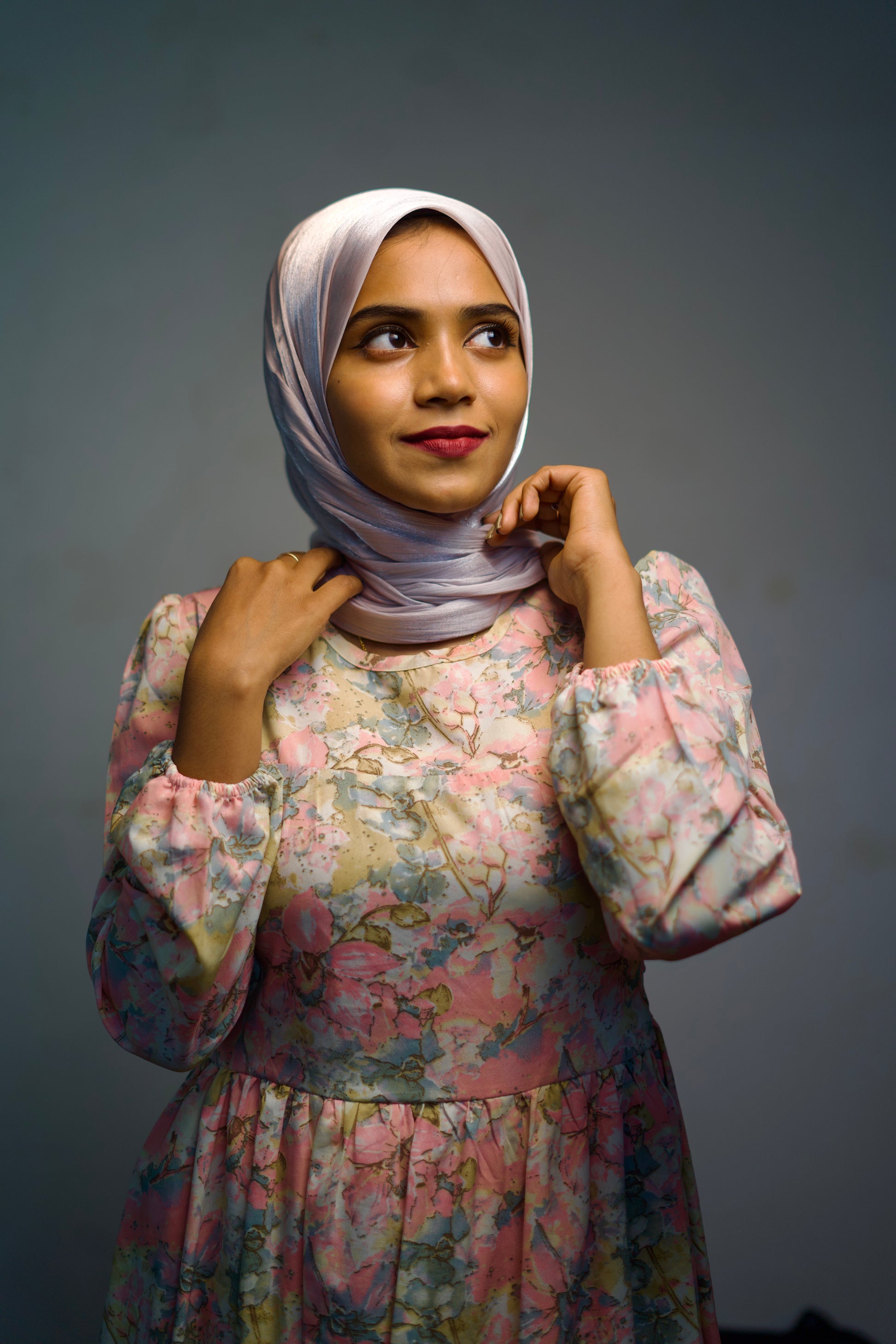 Woman in a Thistle Shimmer Hijab with a neat and glowing front wrap.