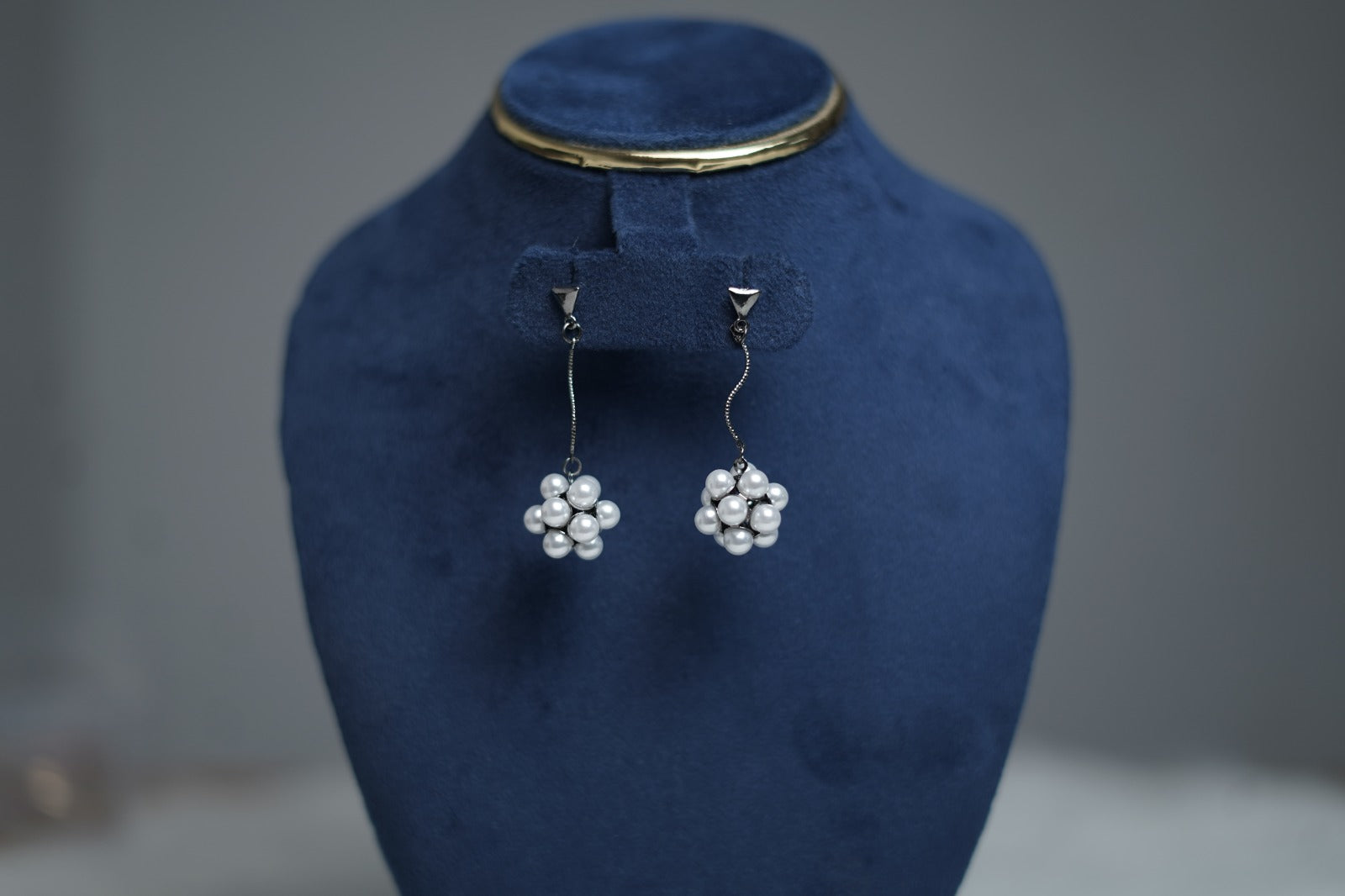 Detailed view of Twilight Pearl Cluster Earrings pearl cluster.